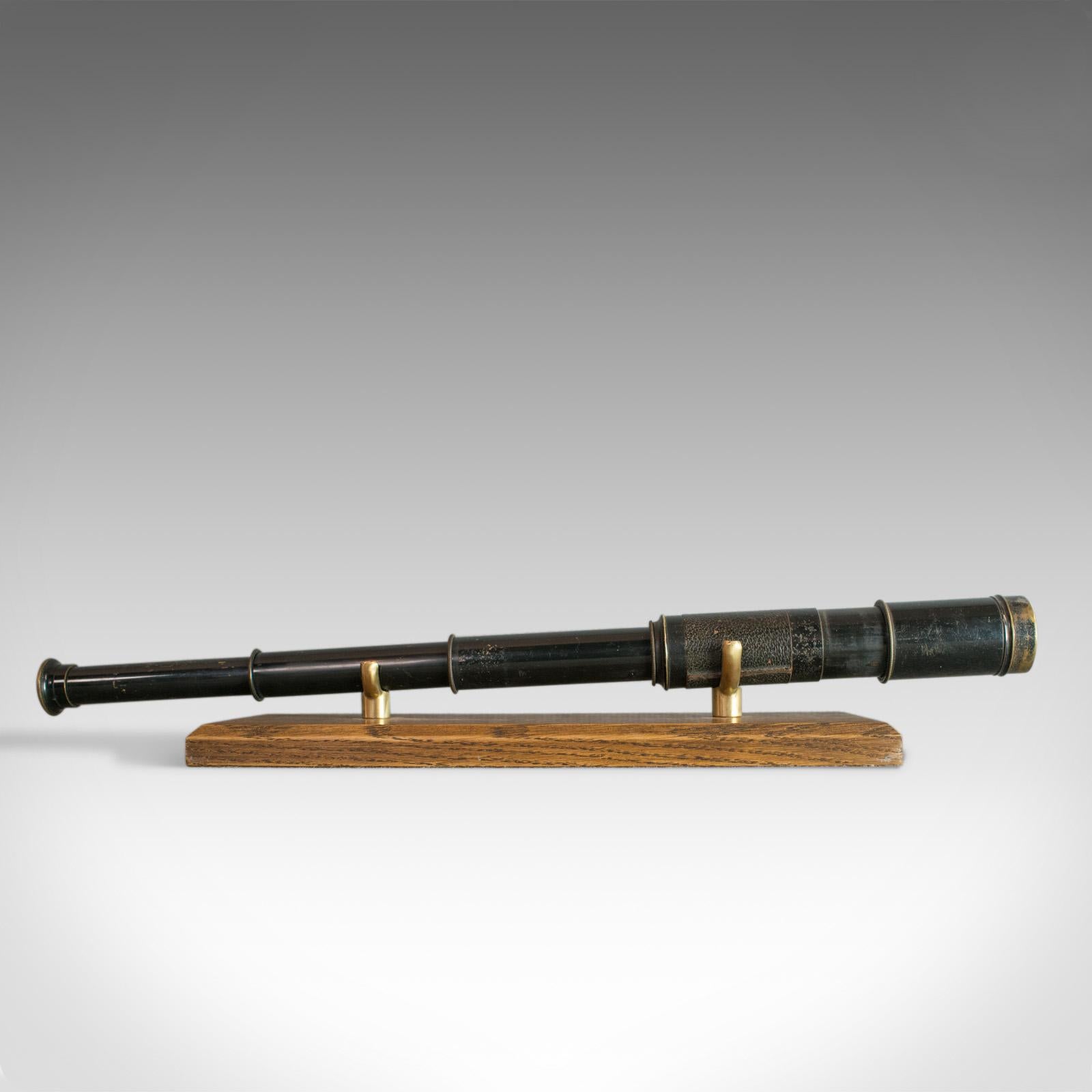 This is an antique pocket telescope, a three draw refractor for terrestrial or astronomical use. An English Edwardian scope dating to the early 20th century circa 1910.

Perfect for bird watching, landscape appreciation, wildlife, or maritime