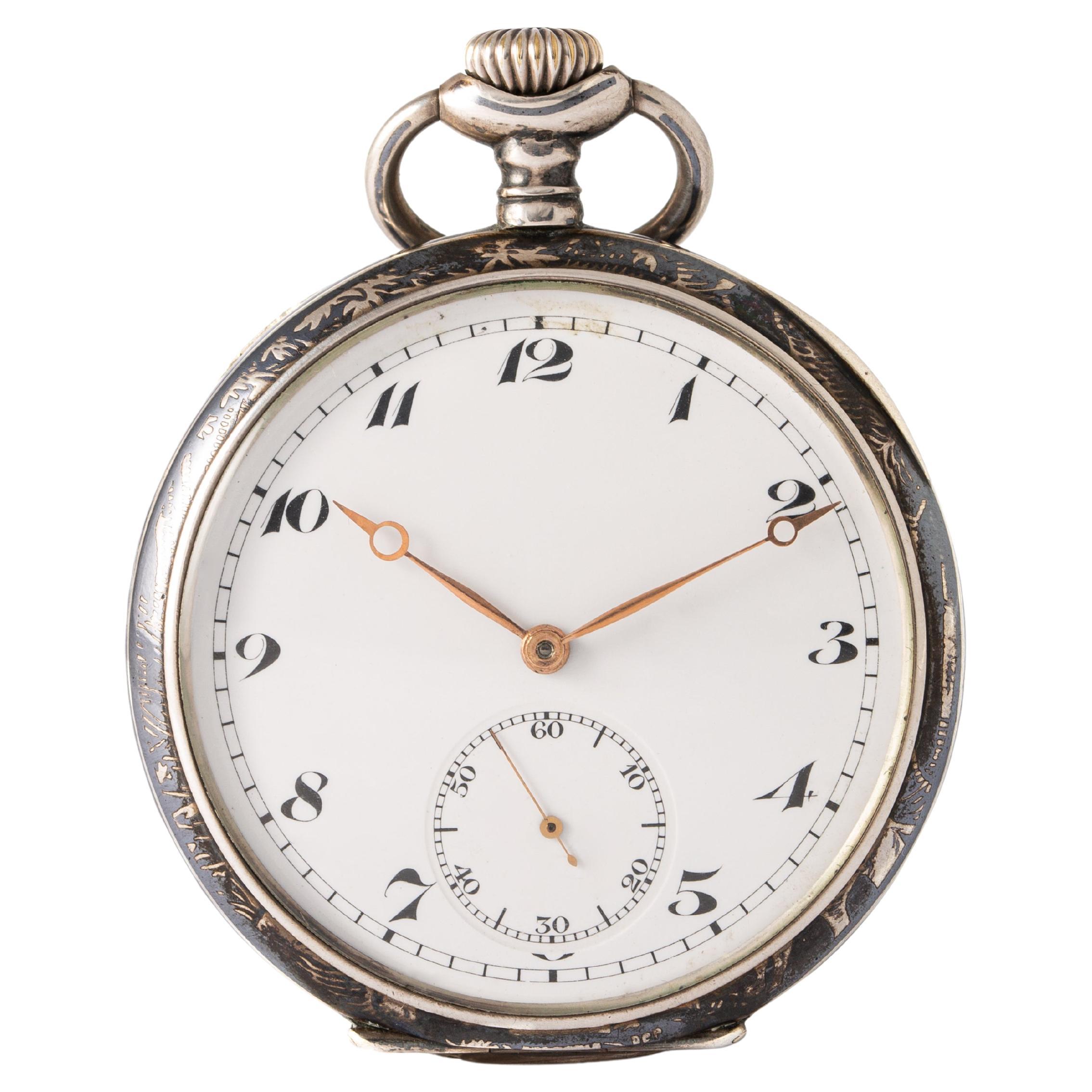 Antique Pocket watch in silver and pink gold representing a hunter and his dogs. 
Movement does not work.
Late 19th - Early 20th century.  
Height: 7.00 cm. Width: 5.10 cm. 
Gross weight: 87.48 grams.