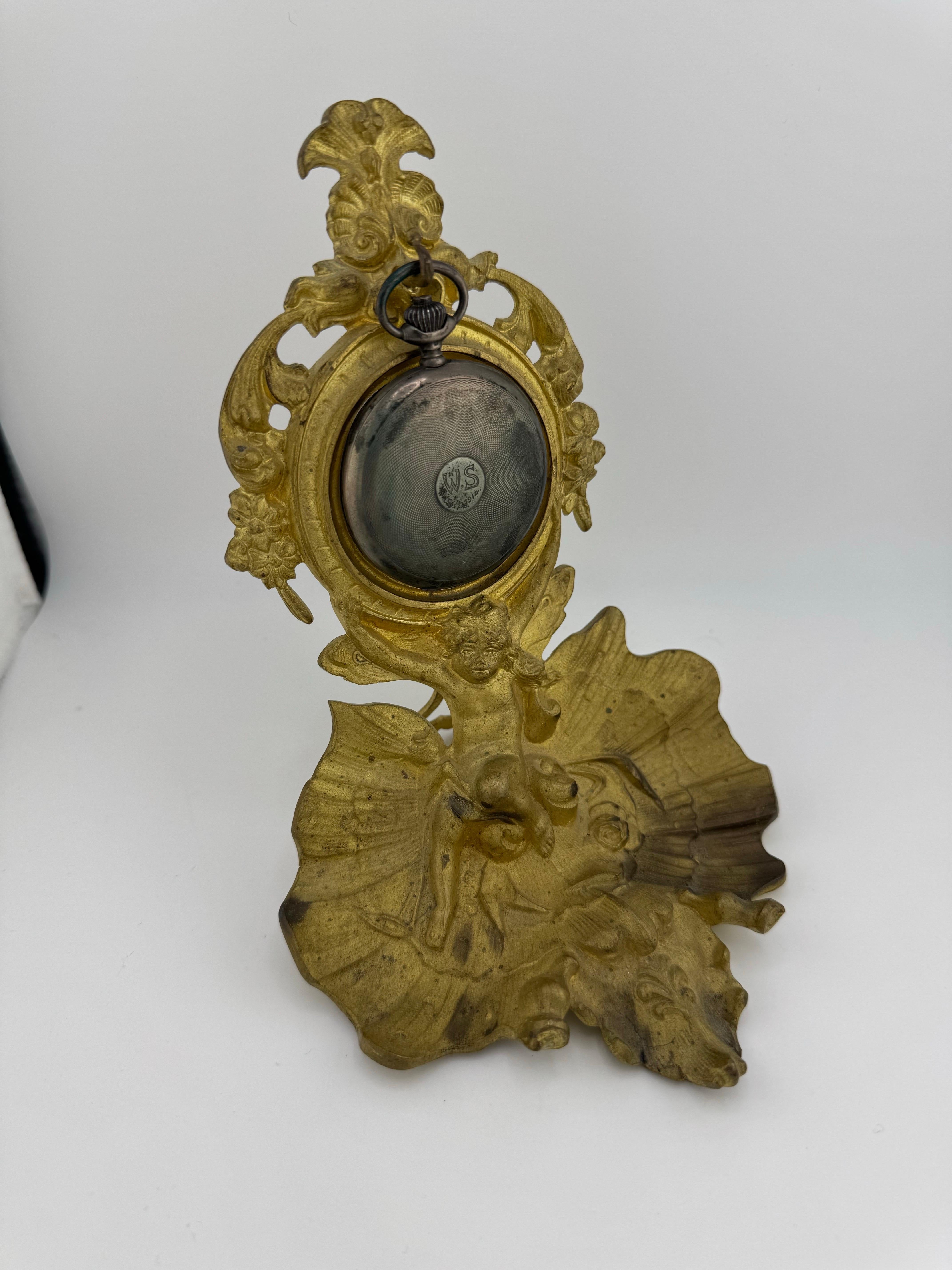 Brass Antique pocket watch holder applies 19th century putto on oyster For Sale