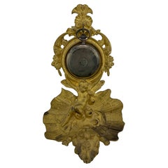 Antique pocket watch holder applies 19th century putto on oyster