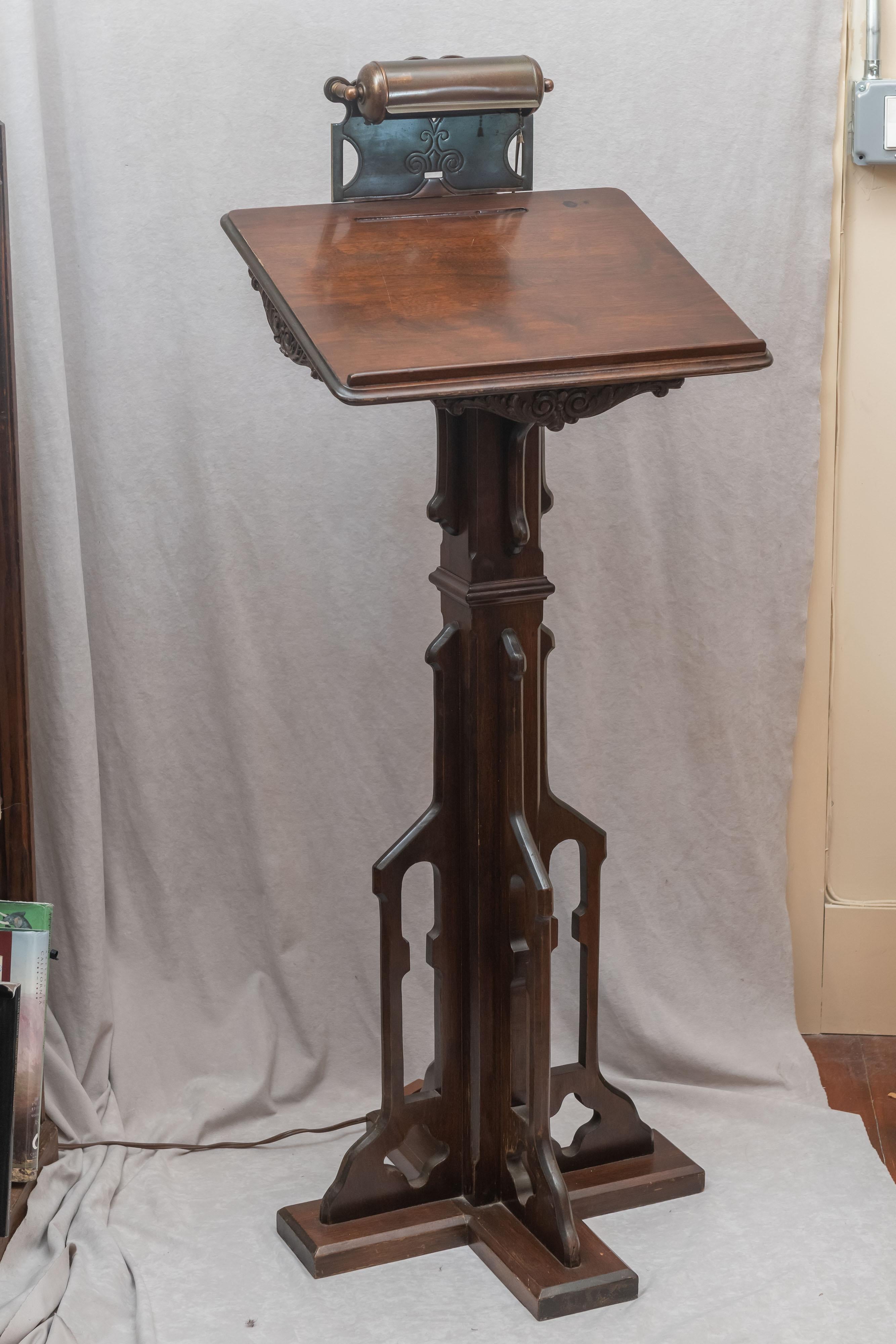 A very practical and well made piece of furniture that can be used for many tasks. We have had a few others in our over 45 years of selling antiques. People have used them for stand up desks, lecterns, dictionary stands and for registration in