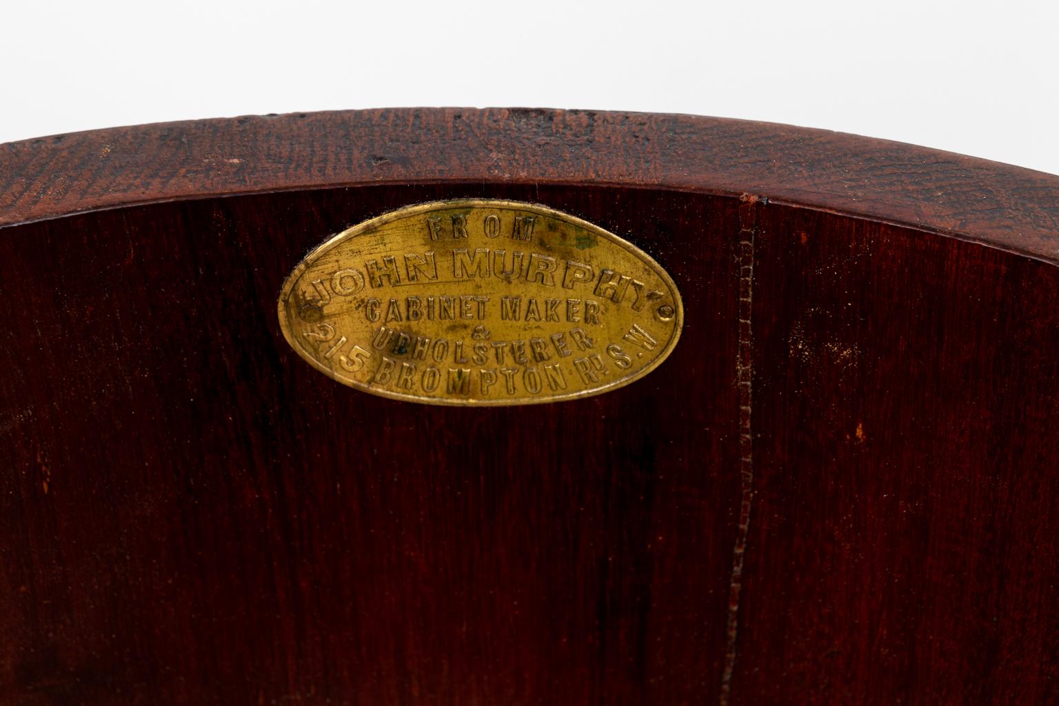 Antique poe table with marble insert on a column shaped base. The drum of the column features an interior cabinet and two shelves along with a maker's plaque of cabinetmaker John Murphy. Please note of wear consistent with age including minor finish