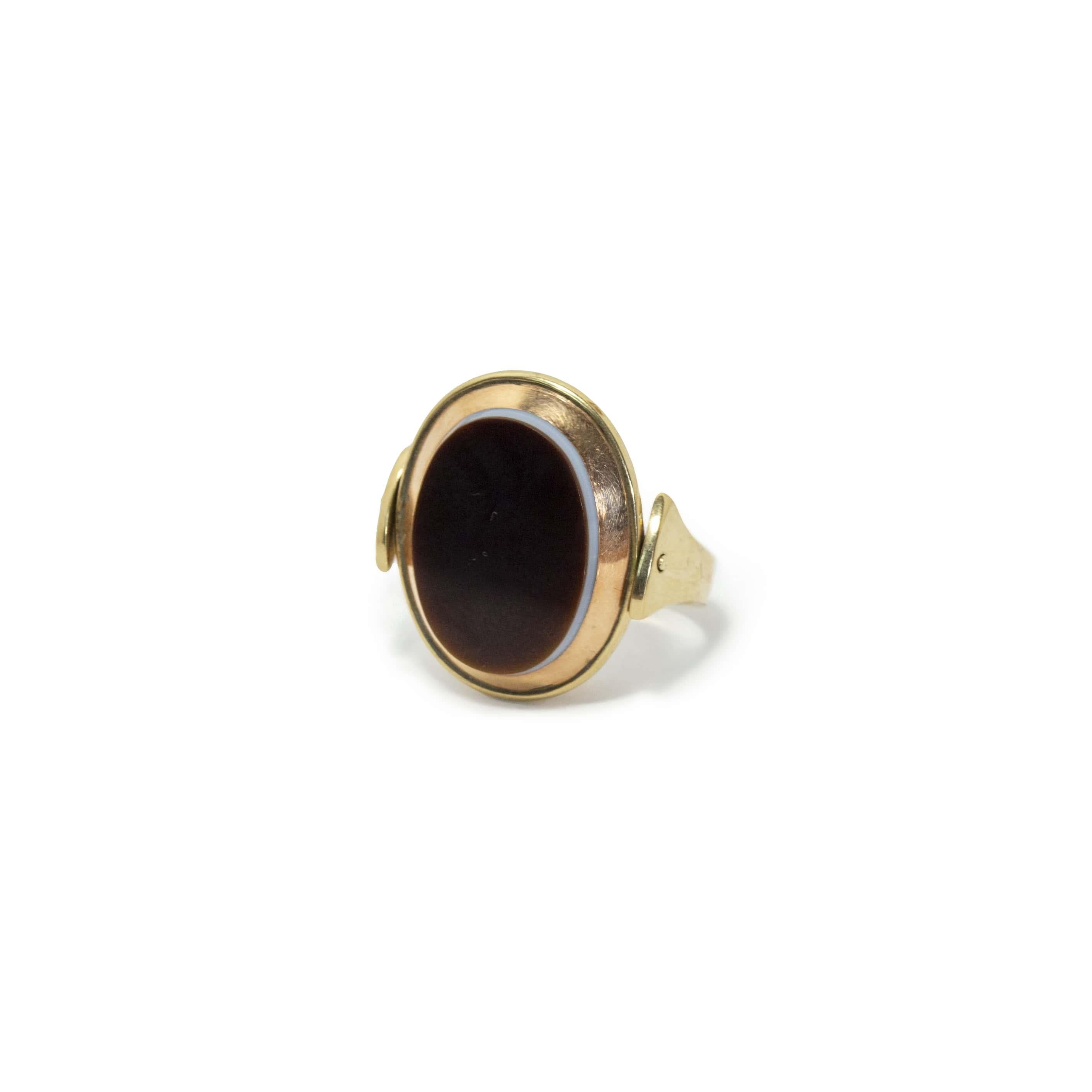 Antique poison locked ring in 10k, solid rose and yellow gold. It’s Swivel (Movable), both sides. Agate stone in white on one side, the other side has black agate.
