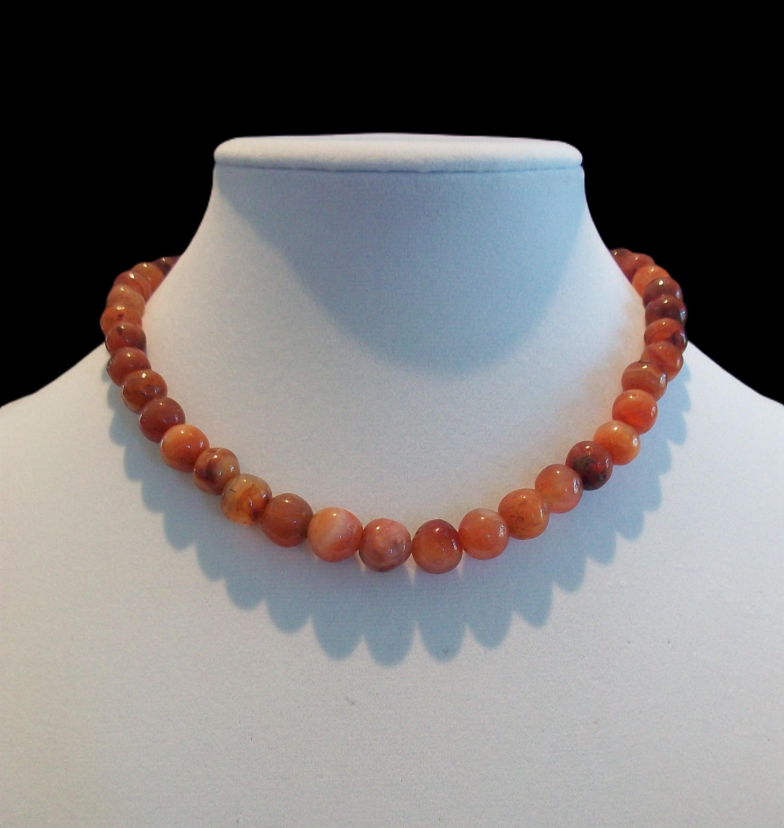Antique Baltic amber graduated bead necklace - featuring round polished beads (many with organic inclusions) - original brass barrel clasp - early 20th century.

Excellent antique condition - all original - no loss - no damage - no repairs - signs