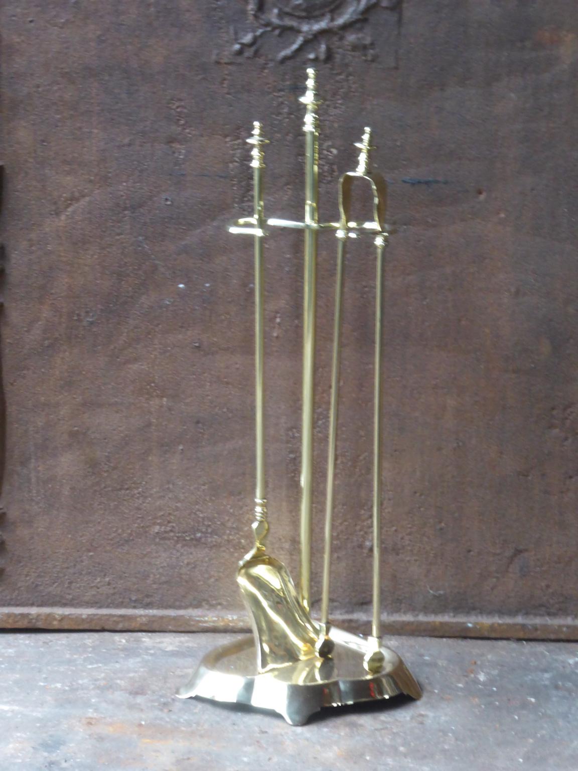 19th-20th century French Napoleon III fireplace tool set made of polished brass. The tool set consists of a stand and two fireplace tools. The condition is good.







  