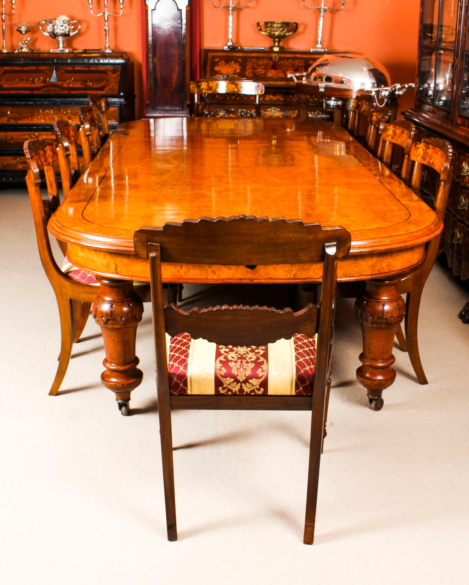 There is no mistaking the style and sophisticated design of this fabulous dining set comprising a rare English antique Victorian pollard oak extending dining table, circa 1850 in date and a set of ten contemporary dining chairs. 
The styles that