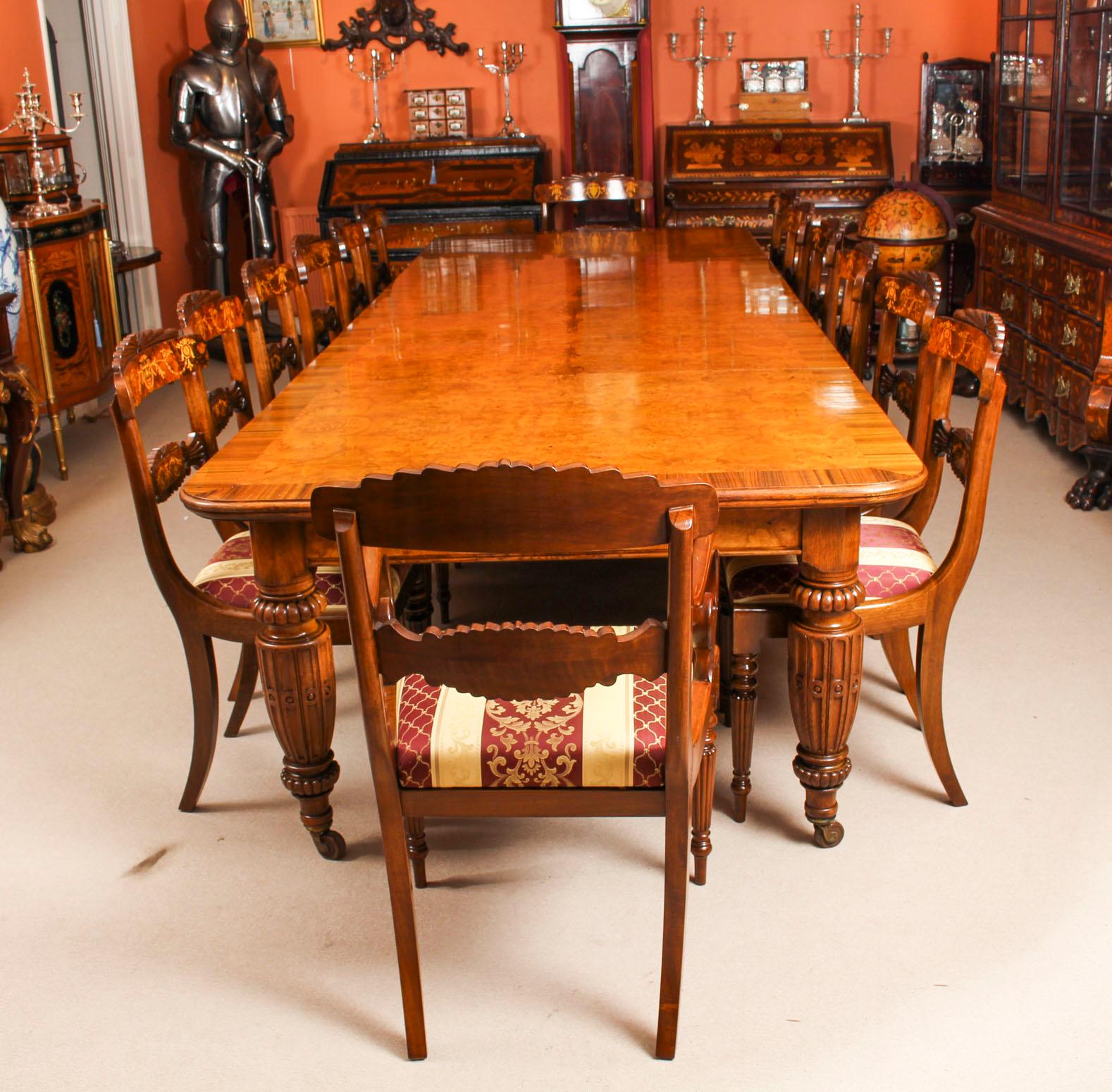 There is no mistaking the style and sophisticated design of this exquisite dining set comprising a rare English antique Victorian pollard oak extending dining table, circa 1860 in date and a set of twelve contemporary inlaid dining chairs.
The