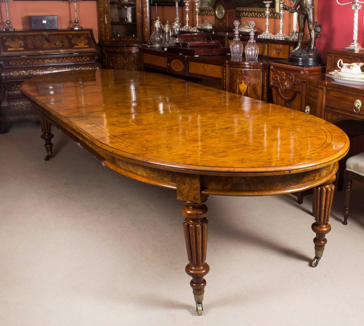 There is no mistaking the style and sophisticated design of this exquisite dining set comprising a rare English antique Victorian pollard oak extending dining table, circa 1840 in date and a set of twelve contemporary ballon back dining chairs.
The