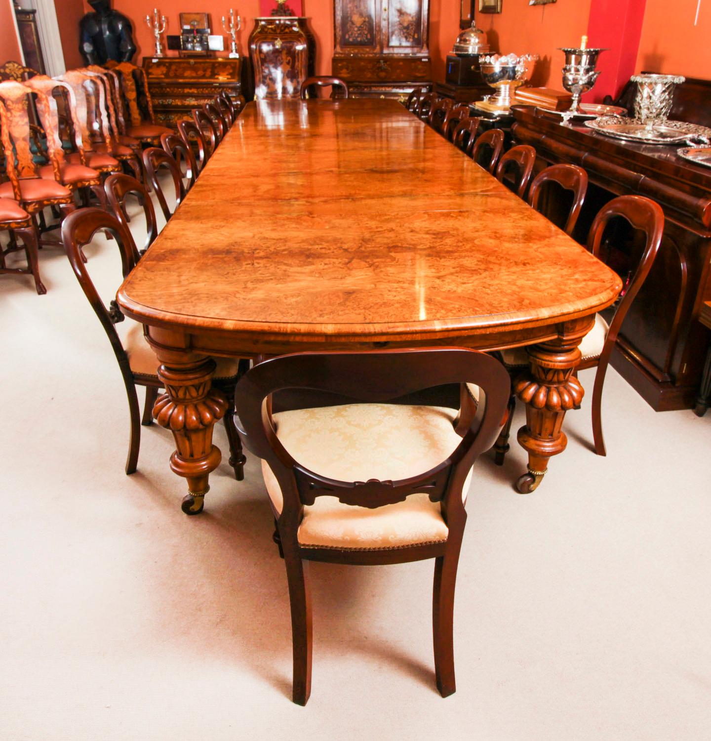 There is no mistaking the style and sophisticated design of this exquisite dining set comprising a rare English antique Victorian pollard oak  extending dining table  Circa 1860 in date and an antique set of fourteen Irish oak open armchairs Circa