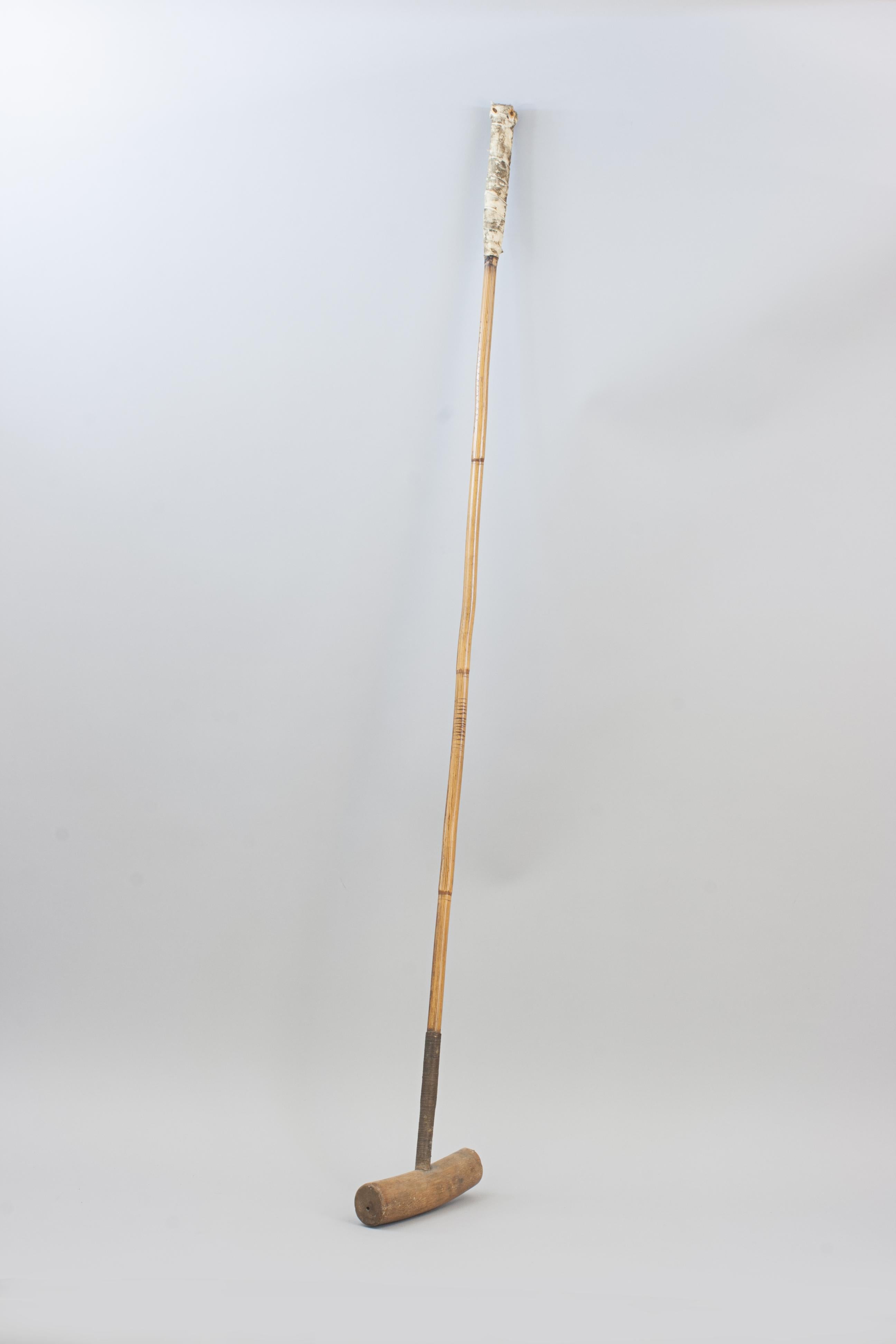 Early Vintage Polo Mallet, J. Salter.
A good late 19th century polo mallet with a round bamboo root head with original rattan, mallacca cane bamboo shaft with original handle made by James Salter & Son, Aldershot, No. 52. It has a round makers stamp