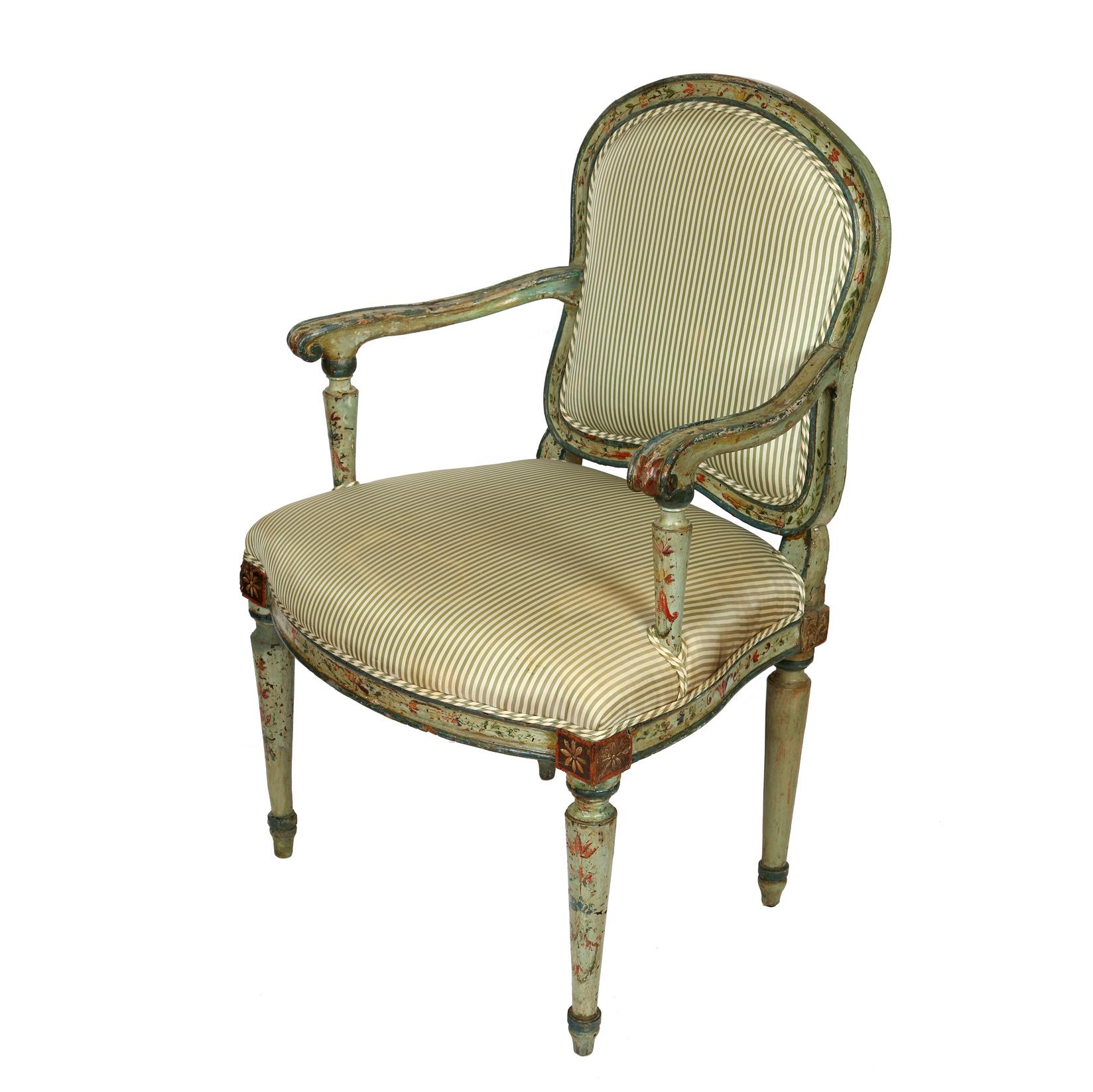 Lovely antique polychrome armchair in green silk ticking stripe fabric on seat and back. Beautiful painted floral detail to arms, legs and frame.