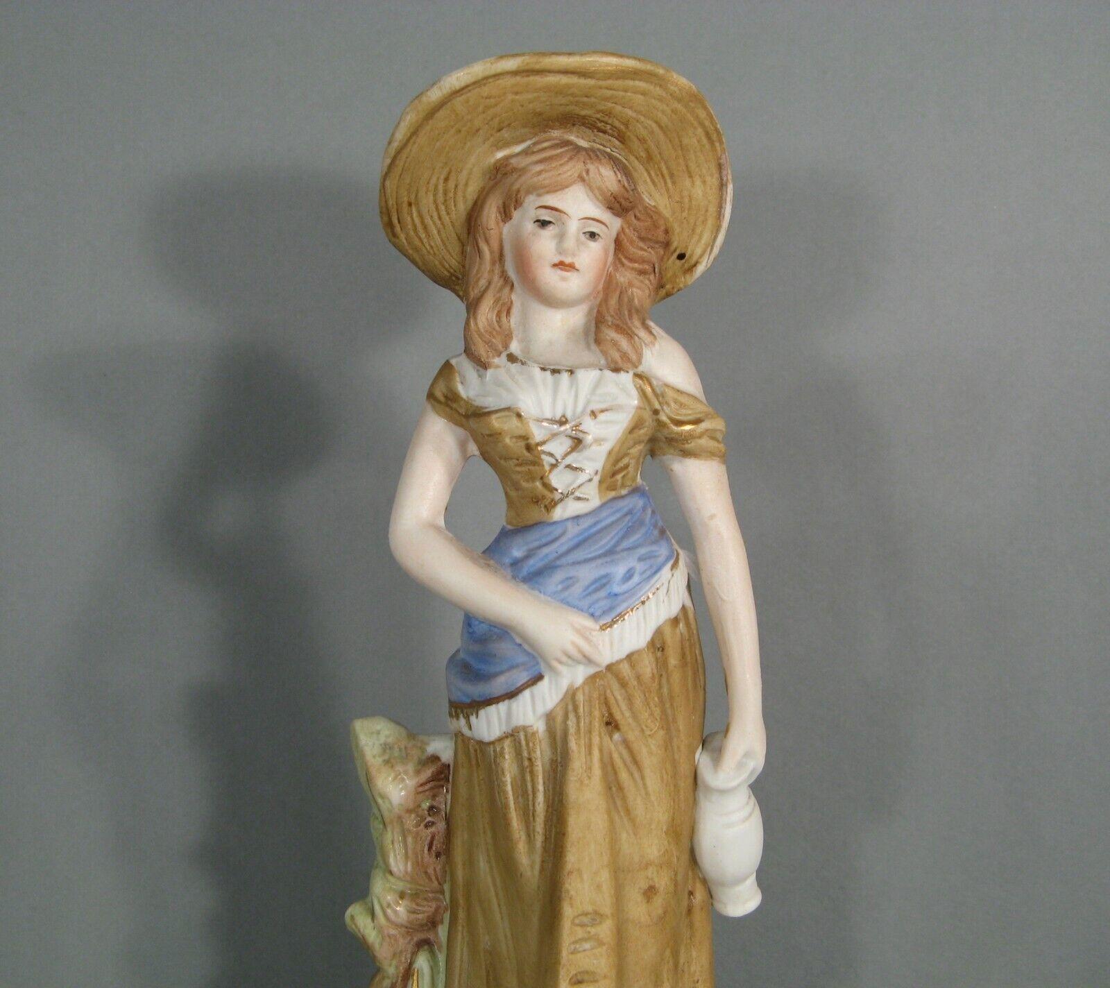 This charming antique figurine, made of polychrome porcelain biscuit, depicts a young woman holding a jug.

Material: Polychrome porcelain biscuit
Design: Figurine of a young woman with a jug
Markings: Numbered 2690 at the back
Period: Early 20th