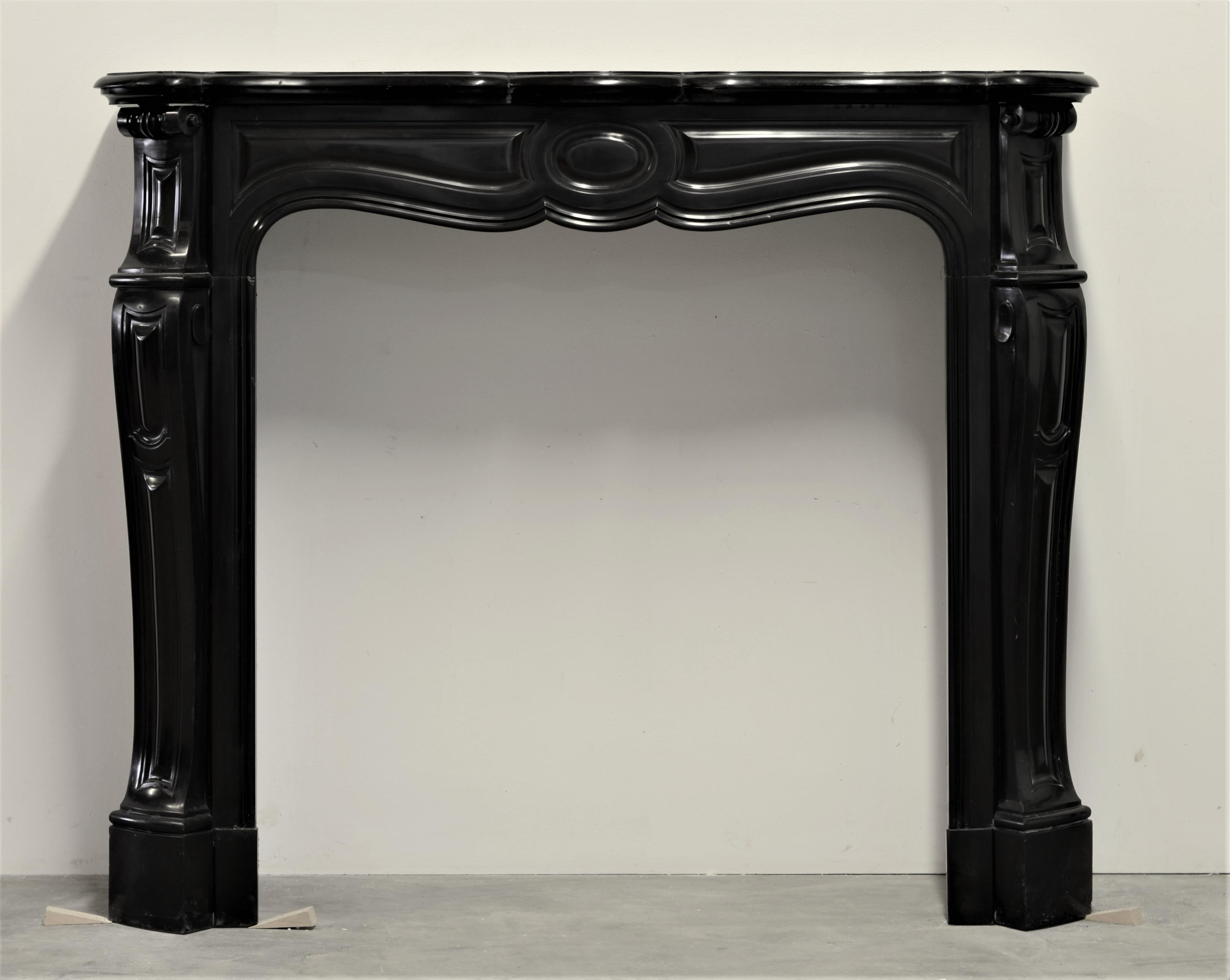 Lovely small sized Louis XV Pompadour style fireplace mantel in Belgian black marble.

The top shelf of this mantel has been professionally restored and braced, the overall condition of the mantel is very good.

Because of it’s seize and ratio