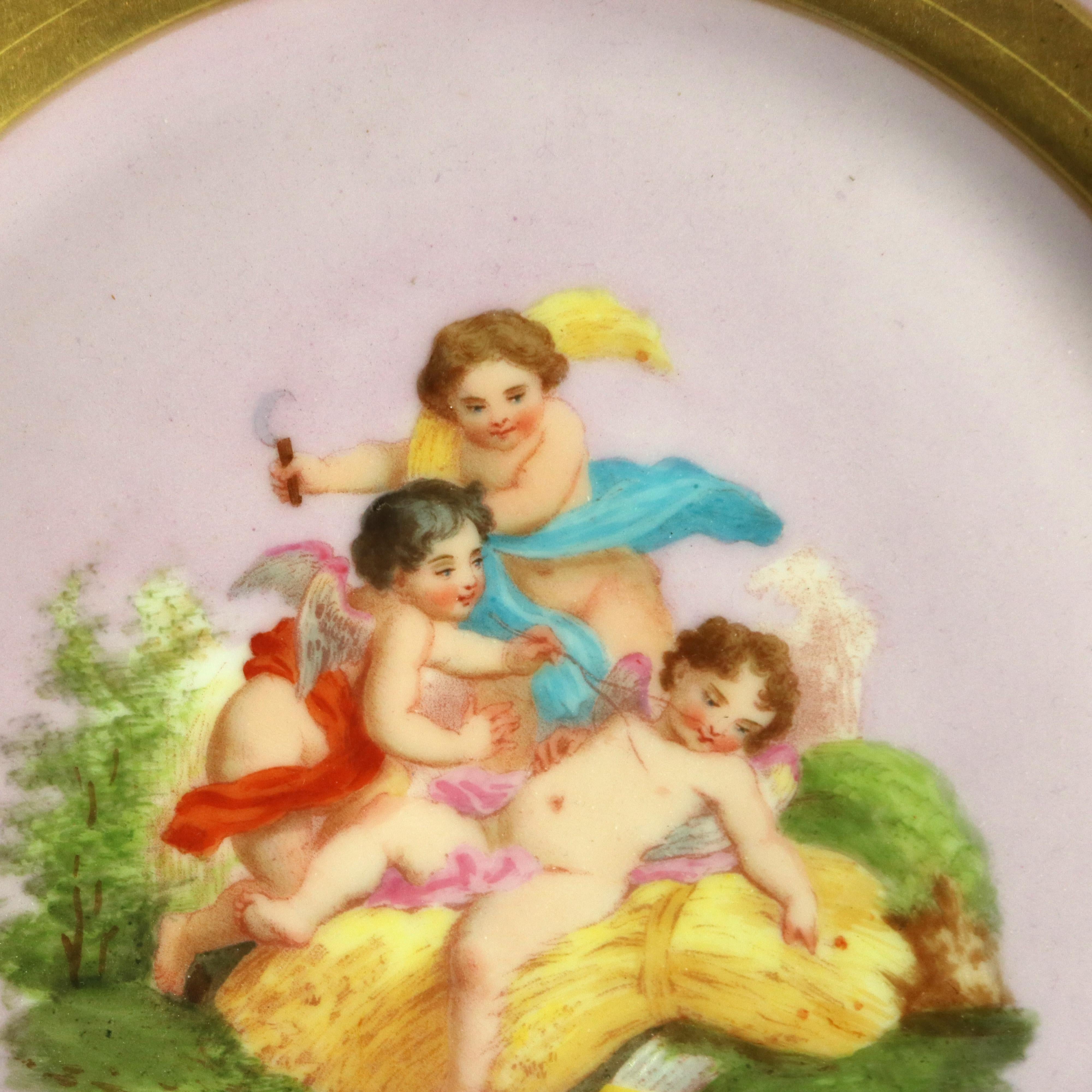 Plateau ancien en porcelaine et bronze peint à la main et doré sur pied avec chérubins, vers 1890

Mesures - 3 1/8