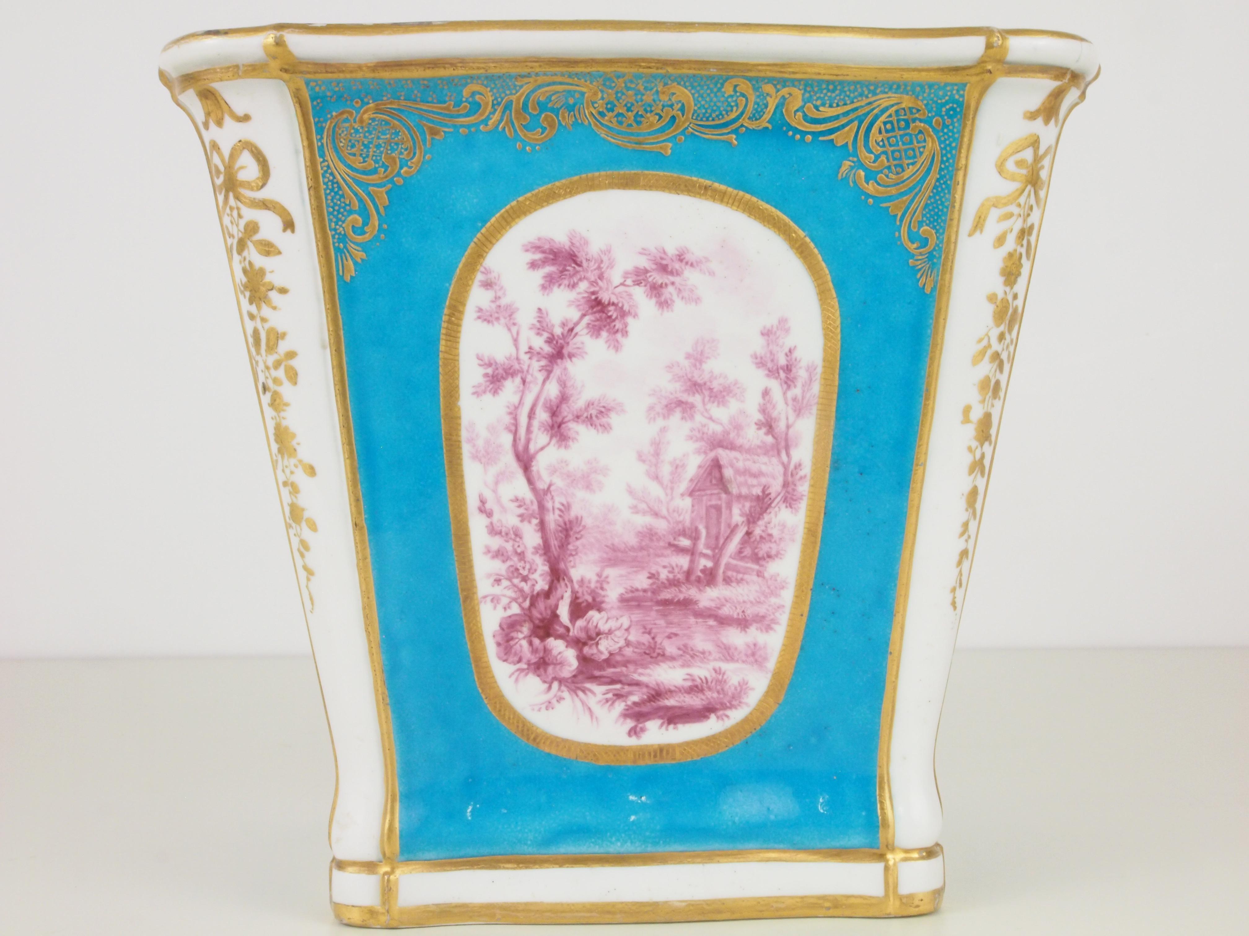 A rare antique porcelain cache pot in rare quadrangular shape from the 18th-19th century with very fine romantic purple images on a stunning celestial blue background with fine hand painted gilded decorations.

This cache pot has underneath the