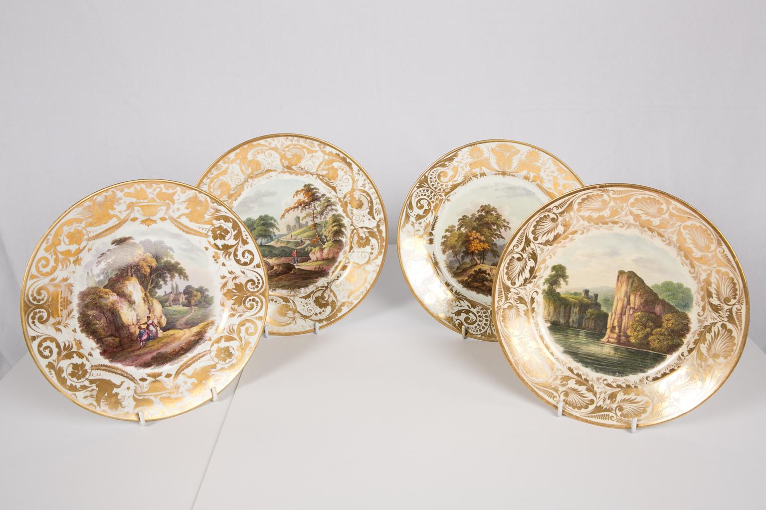 An exquisite set of four Derby antique porcelain dishes with hand-painted landscapes. Each dish with a romantic view of a named landscape in either Britain or Italy. The scenes emphasize the emotion evoked by the beauty of nature. The dishes have