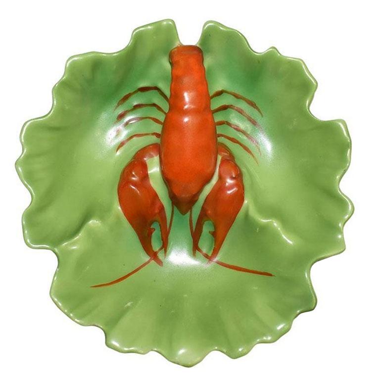 A divided ceramic porcelain dish with a red lobster motif. Glazed in green, this beautiful Victorian dish resembles a red lobster sitting upon a bed of lush green lettuce. The bottom is marked in red with: 