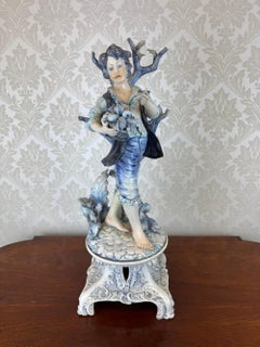 Antique Porcelain Figurative Sculpture of a Boy with Fruit Basket, 19th Century