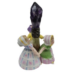 Antique porcelain figurine with an amethyst crystal, circa 1900