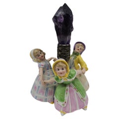 Antique porcelain figurine with an amethyst crystal, circa 1900