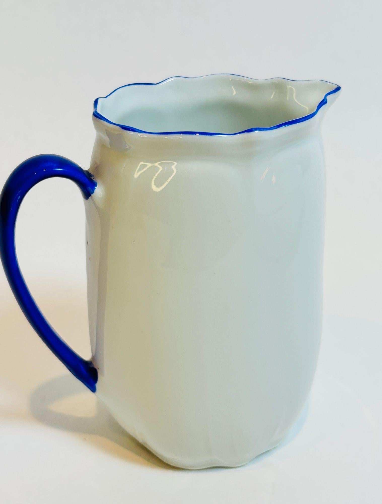 Antique Victoria China Czechoslovakia Porcelain Milk Jug  Hand-Painted Dutch Children Scene, circa 1940s
A charming and highly collectible antique bone china milk jug by Victoria China, Czechoslovakia, dating to the 1940s. This finely crafted