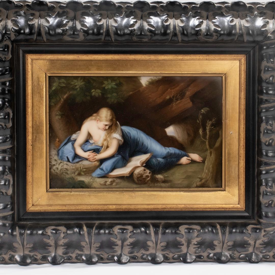 A fine antique German hand painted porcelain plaque.

In the Royal Berlin (KPM) or Royal Vienna style.

Depicting the Reclining Mary Magdalene Reading In the Wilderness after Pompeo Girolamo Batoni.

Mounted in a contemporary black foliate frame.