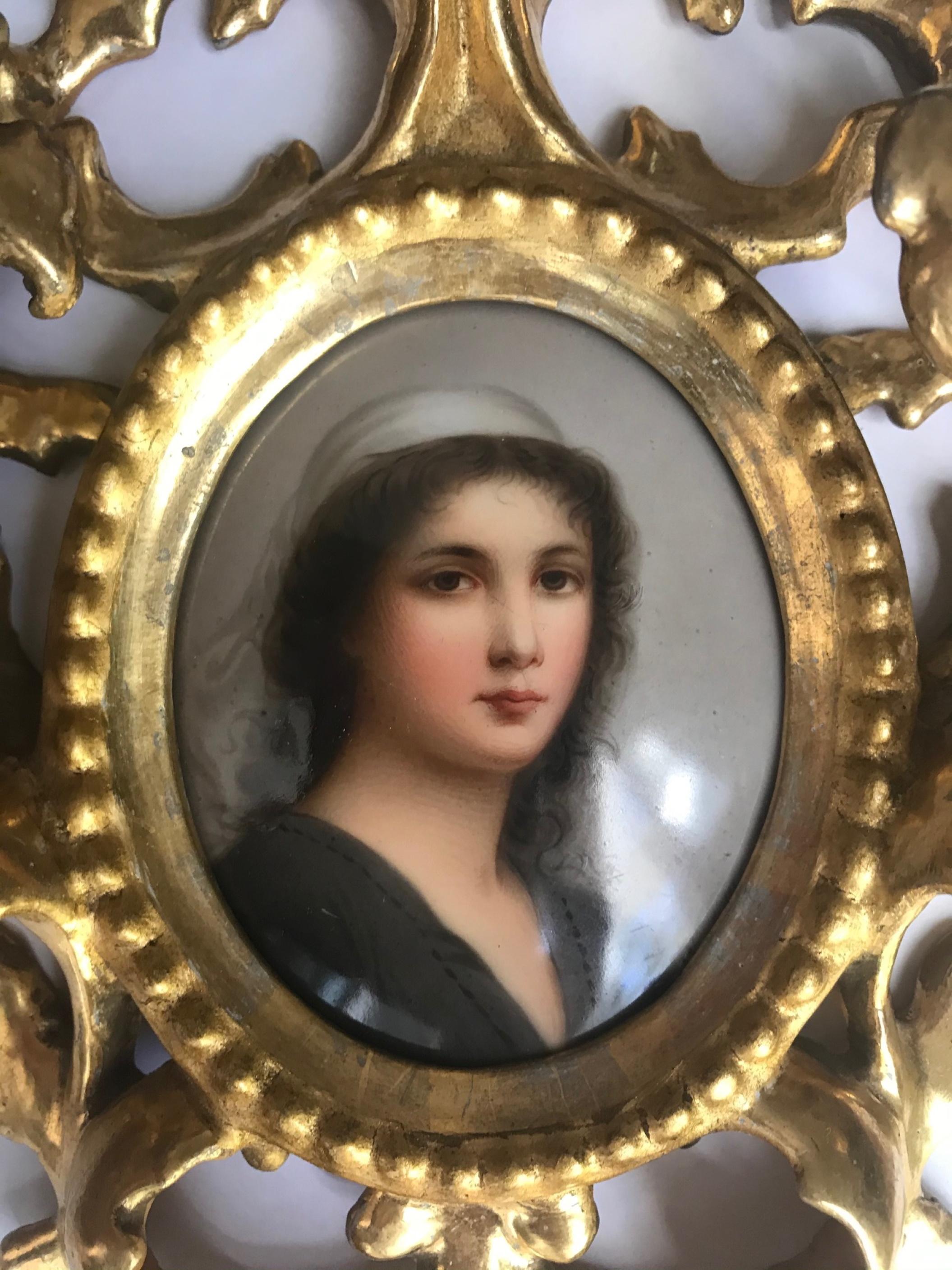 Antique porcelain portrait miniature plaque KPM style.

This lovely German hand painted oval porcelain plaque is a beautiful and skillful wall hanging portrait of Ruth. It is housed in a gorgeous, ornate hand carved water gilded Florentine