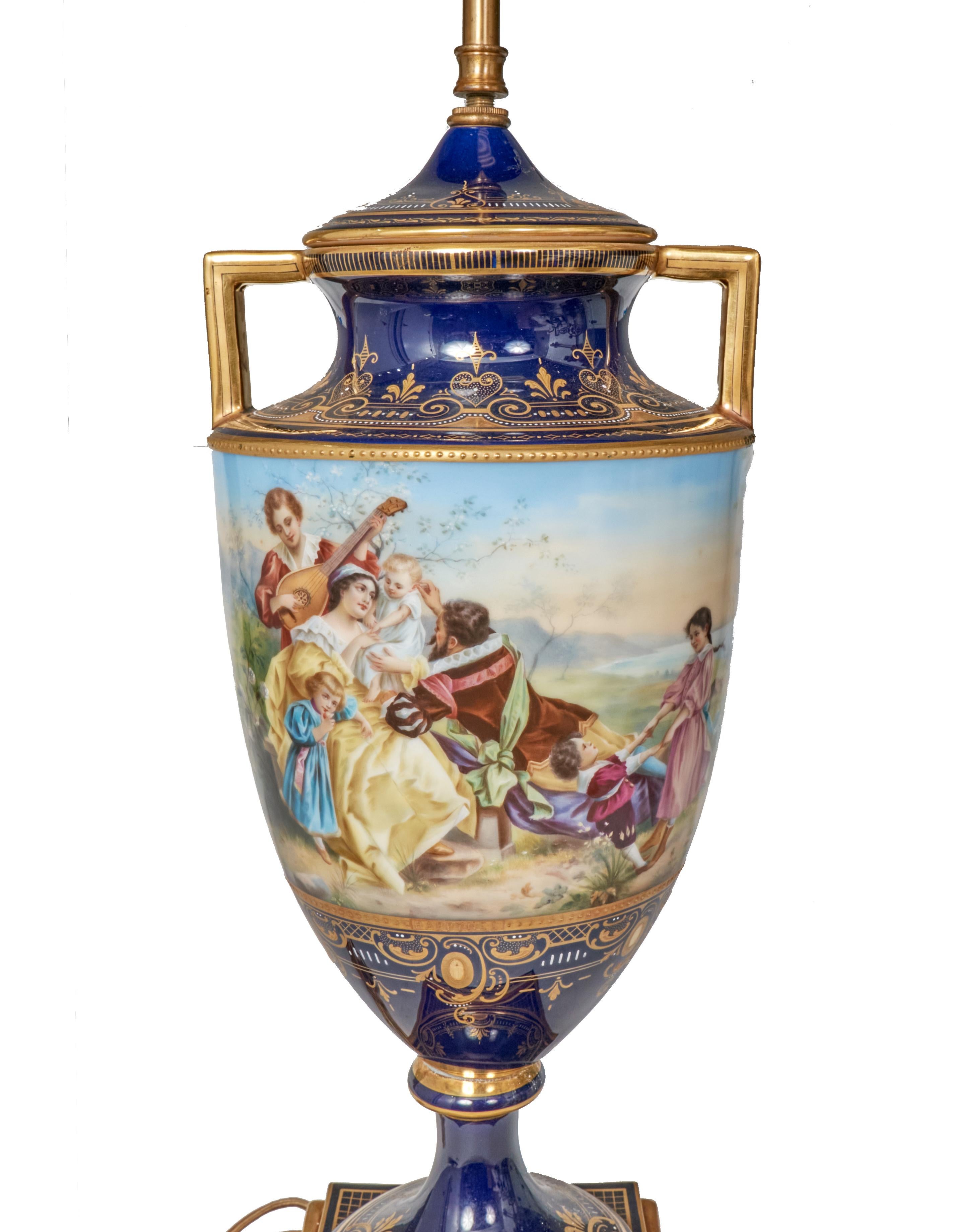 Stunning large Royal Vienna porcelain urn form table lamp in excellent condition. Hand painted scenes depict life labeled below 