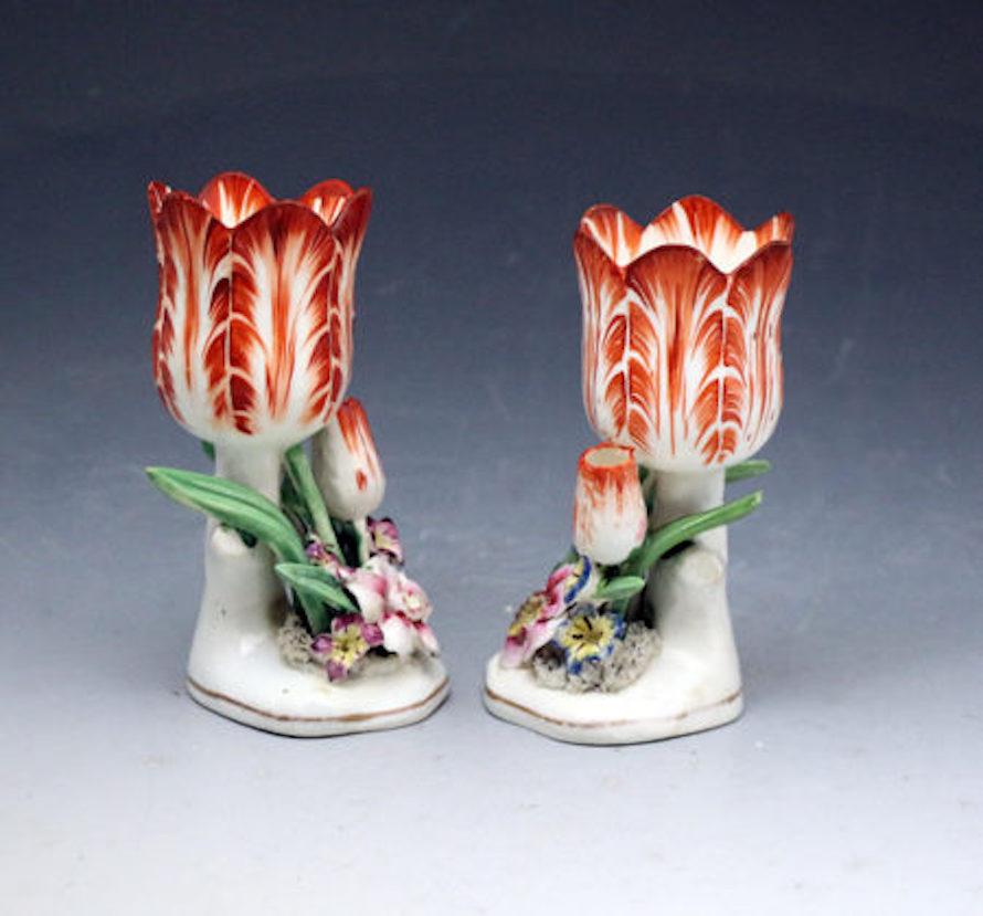 Antique porcelain Staffordshire tulip shaped flower vases, circa 1835

A pair of highly decorative porcelain tulip-shaped vases made in Staffordshire England in the early 19th century period.

Dated: 1835-1840 Staffordshire