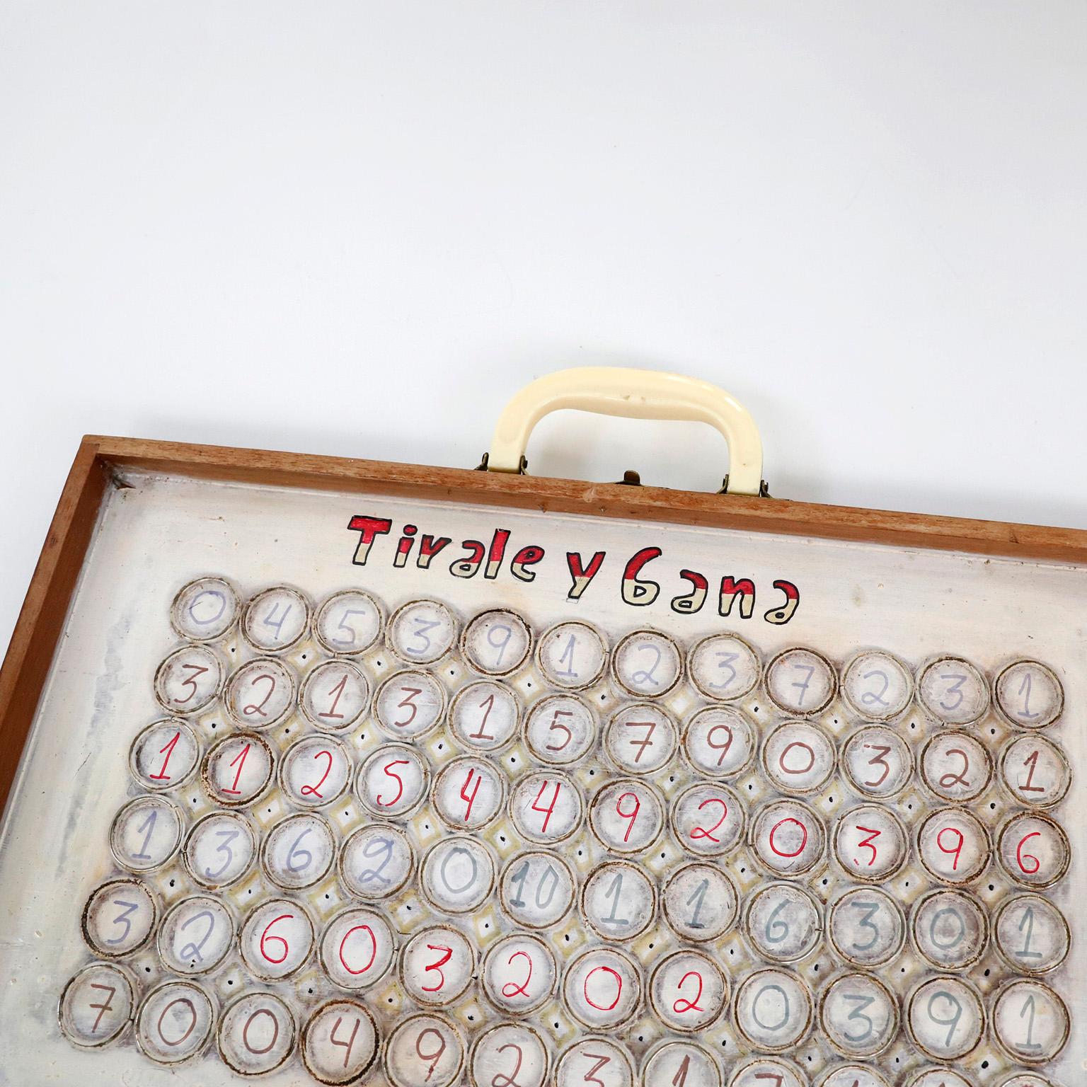 Circa 1980. We offer this Antique portafolio game used in Mexican Fairs.

The piece is placed on the floor and coins are thrown from a certain distance. The idea is that the coins fall inside the circles. this piece can be used for wall decoration