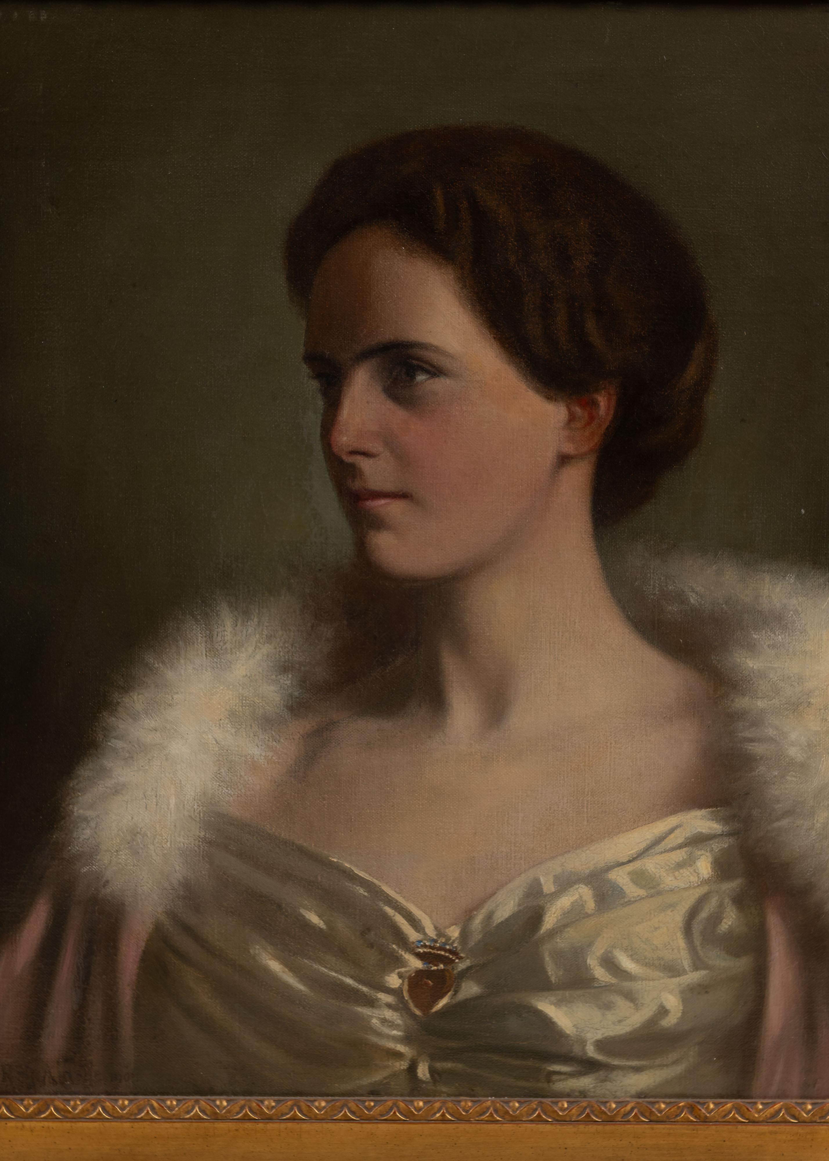 Joli portrait ancien d'une femme élégante à l'huile sur toile dans un cadre orné et doré. 