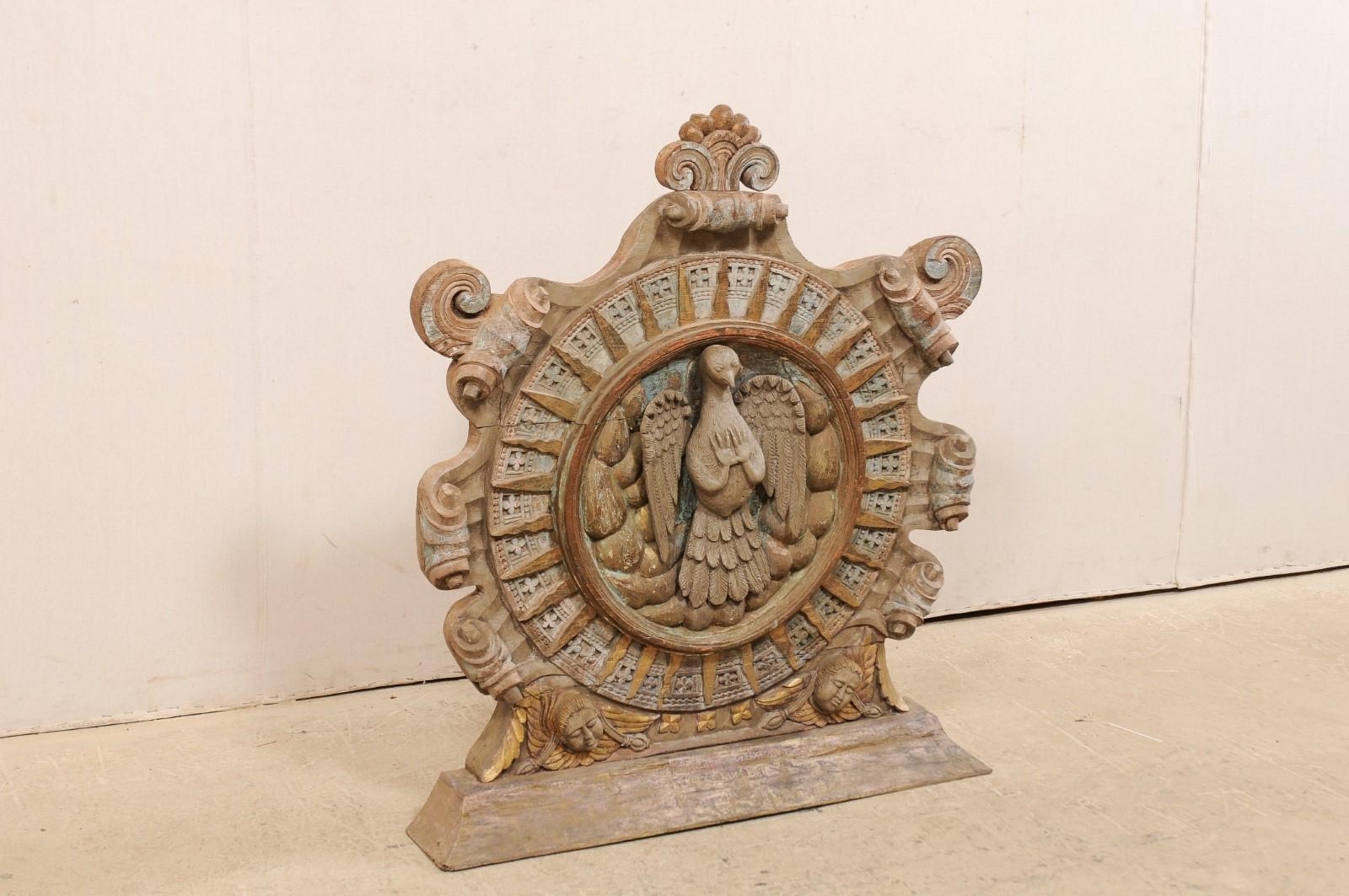 A beautifully hand carved and painted wood Portuguese church fixture from the early 20th century. This antique panel, which originally decorated a Portuguese church in Goa (located in the Southwestern coastal region of India), stands just under 3.5