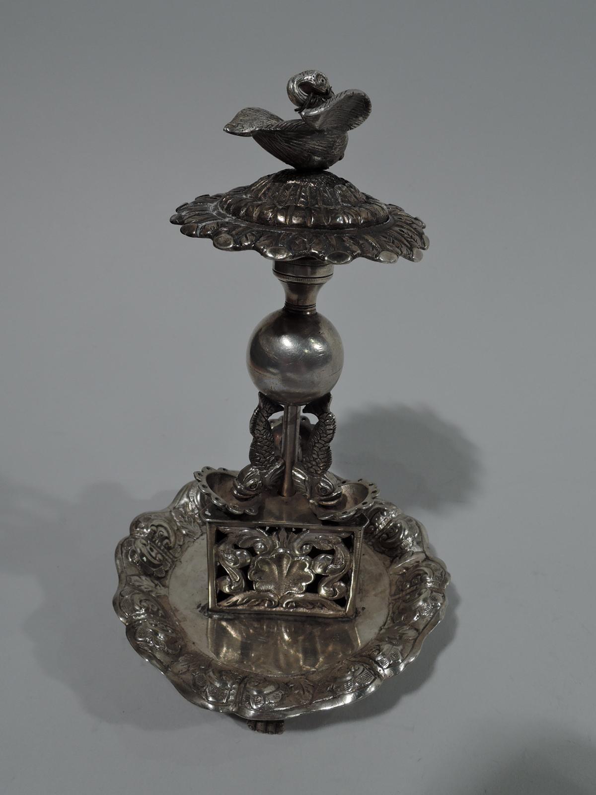 Antique Portuguese neoclassical silver toothpick holder. Narrow cylindrical shaft surrounded by dolphins on scallop shells supporting ball and mounted to triangular base with pierced scroll-and-shell sides. Round tray with scalloped rim and chased