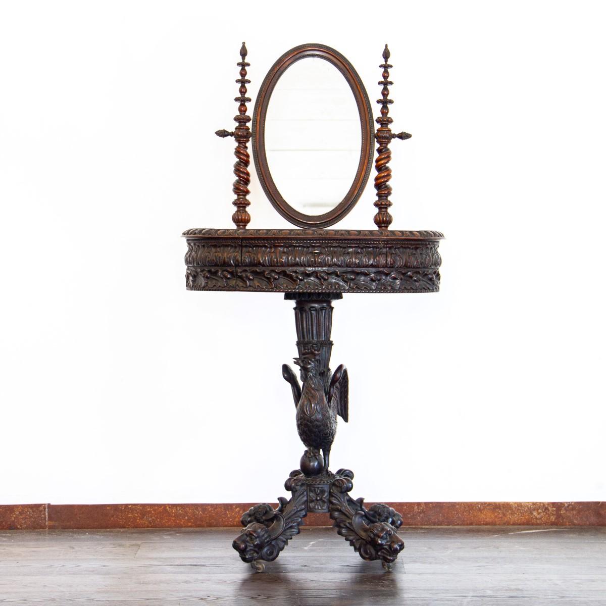 A stunning 19th century Anglo-Portuguese dressing table. (toilet/vanity table) The table is supported with exotic timbers in a swirled pedestal design leading to a carved cockeral, standing on a platformed base with four very well carved lion head