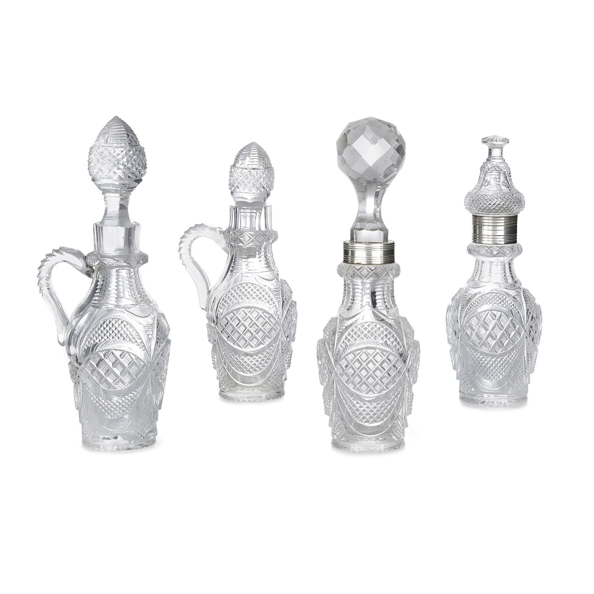 Antique Portuguese silver and cut glass cruet set
Portuguese, early 20th century
Measures: Height 30cm, width 21cm, depth 21cm

This fine Portuguese cruet set is crafted from silver and cut glass. The set includes four glass decanters, the glass
