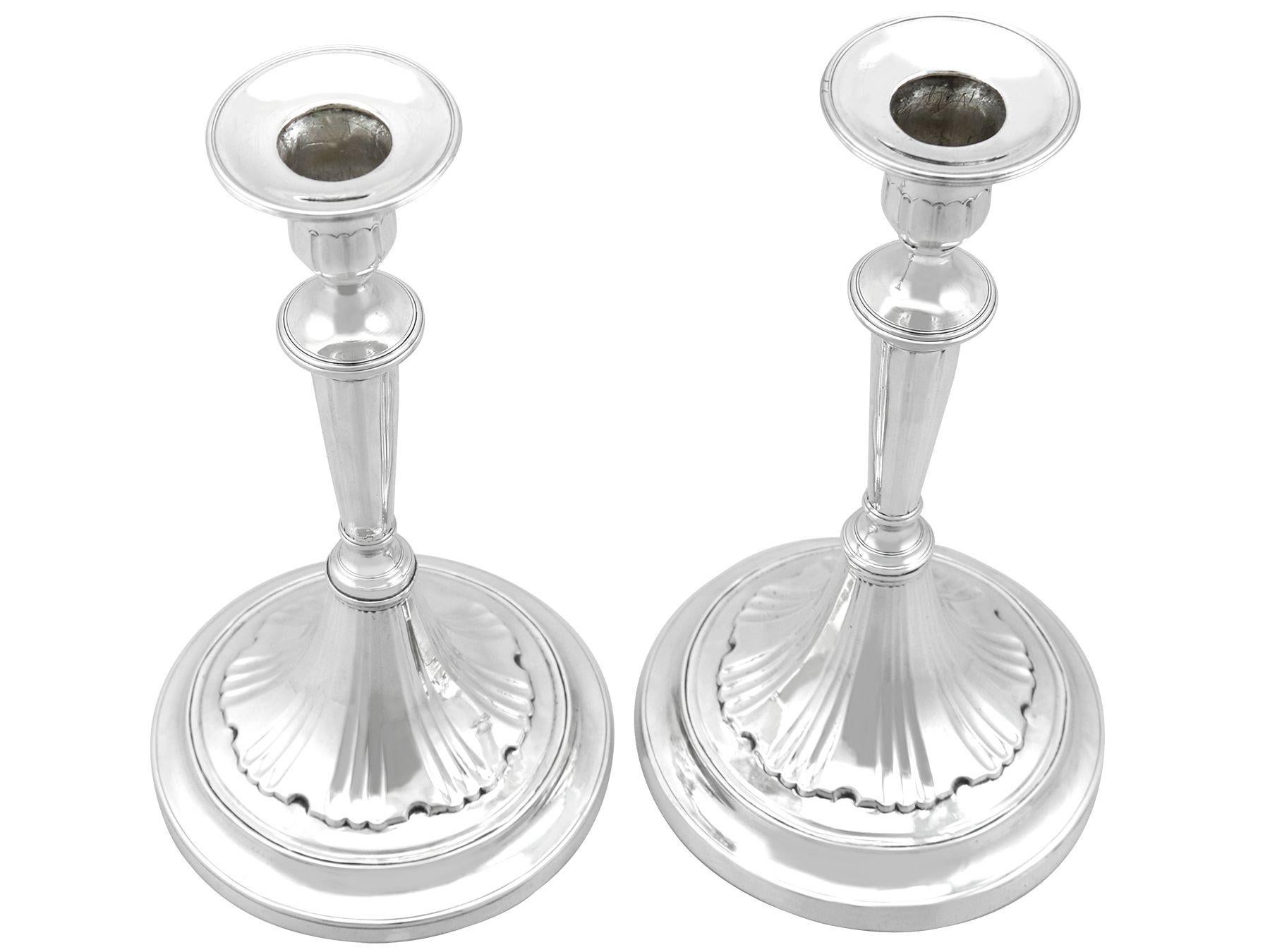 An exceptional, fine and impressive pair of antique Portuguese cast silver candlesticks; part of our 19th century ornamental silverware collection

These exceptional antique Portuguese cast silver candlesticks have a circular rounded knopped form to