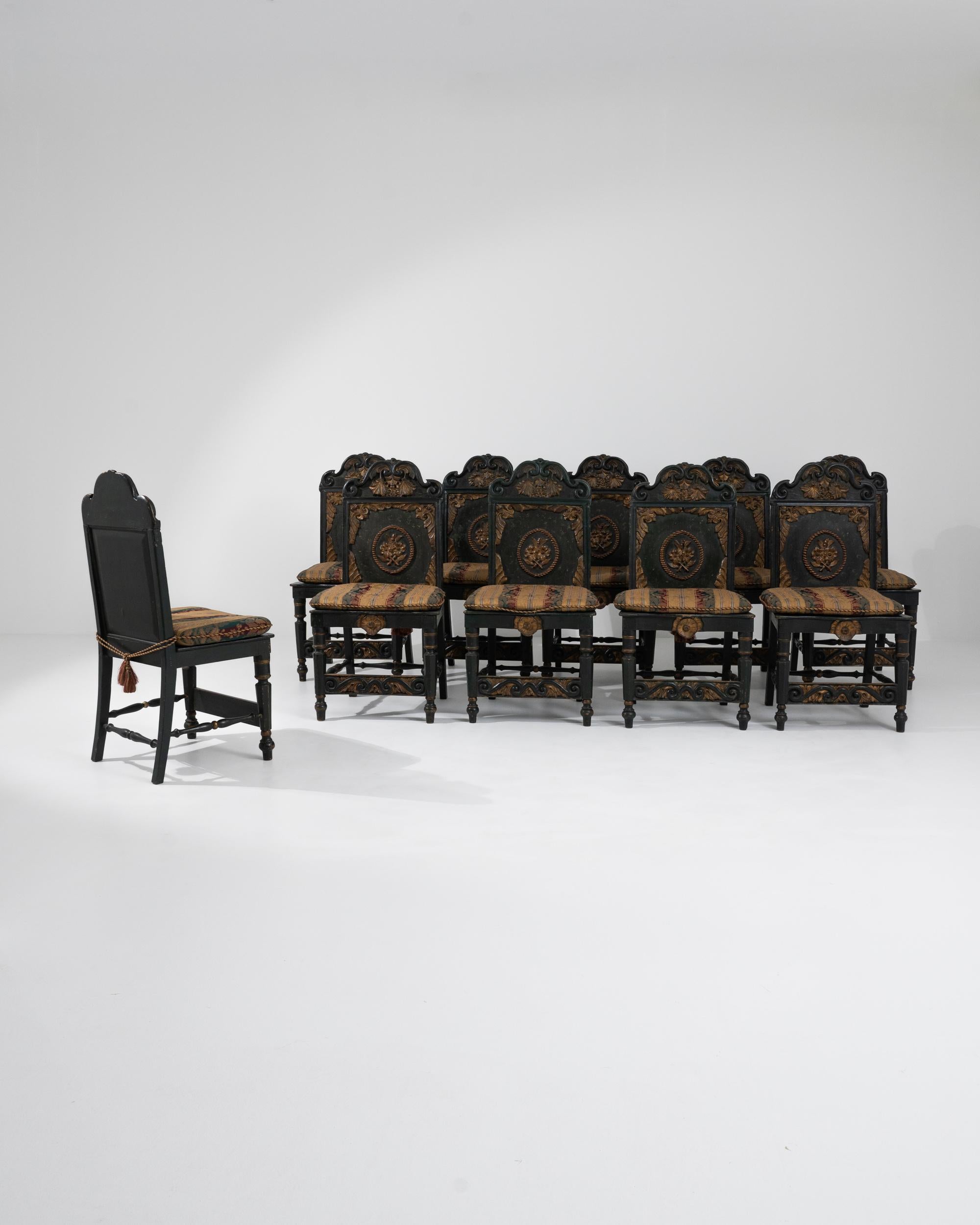 A set of vintage Portuguese wooden chairs with cushioned seats from the 20th century. Made in a historic style, this set of majestic chairs is painted forest green and gold, fit with seat cushions to radiate regality and precise uniformity. Lavishly