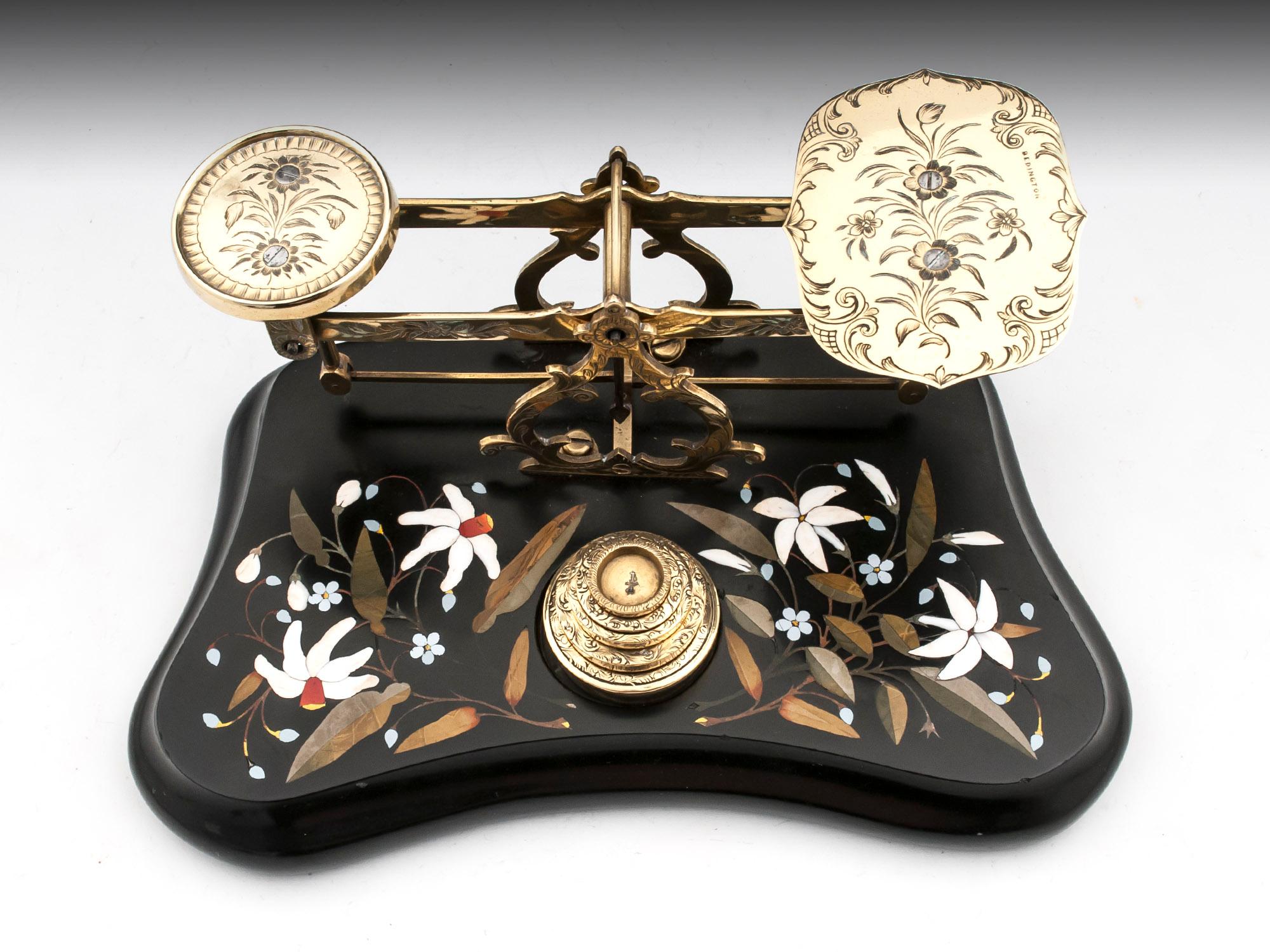 Antique brass engraved postal scales with an elaborate inlaid Ashford marble base and engraved weights.