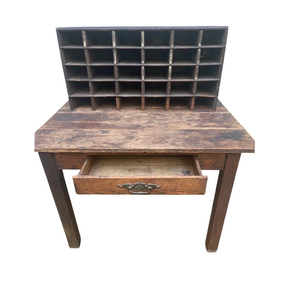 Antique wooden post office sorting desk with a beautiful, rich brown patina. 