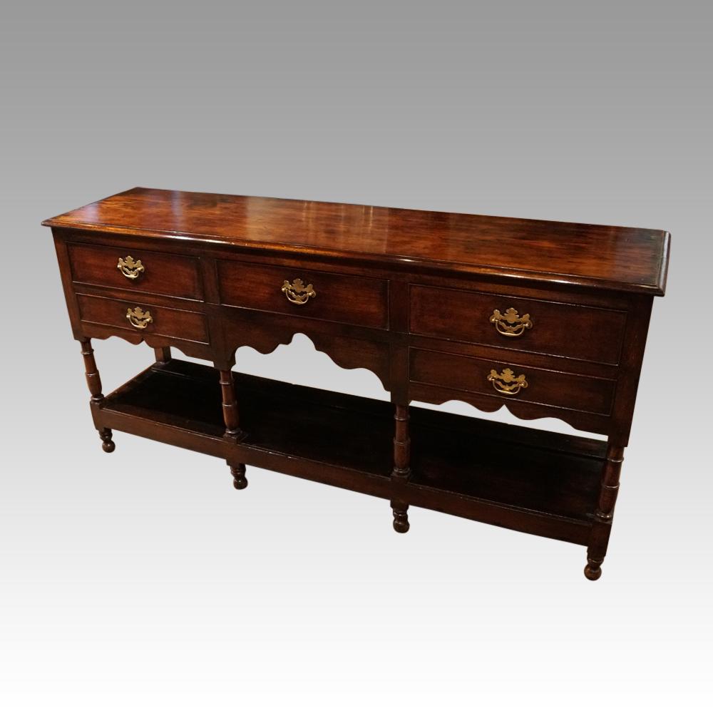 Antique pot board oak dresser base
This antique pot board oak dresser base was made, circa 1825.
It is of a beautiful warm brown color with a fantastic patina.
The antique oak pot board dresser base is fitted 3 drawers along the top, a further