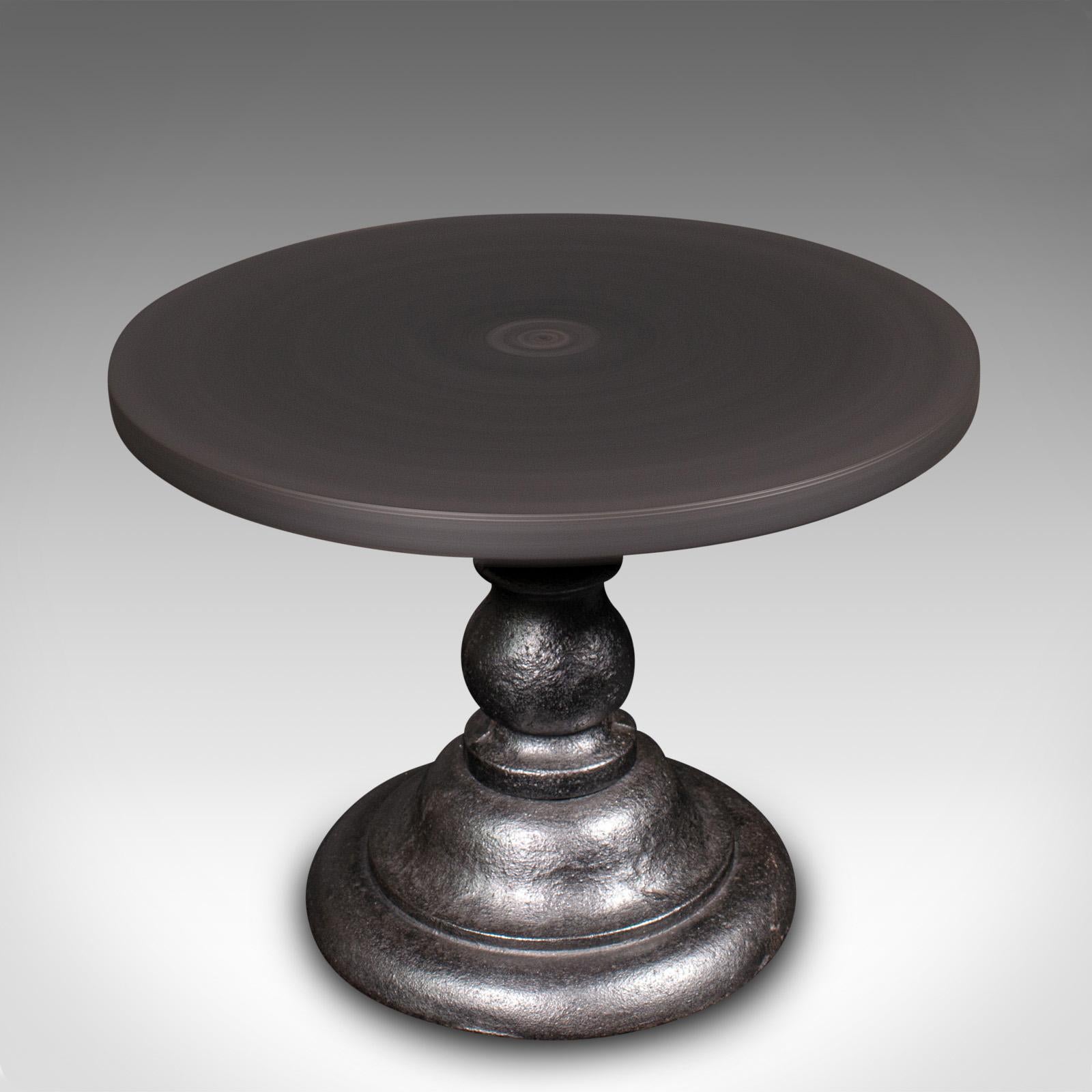 
This is an antique potter's decoration wheel. An English, cast iron rotary finishing plinth, dating to the late Victorian period, circa 1900.

Appealing potter's aid, with a useful rotary plinth
Displays a desirable aged patina and in good