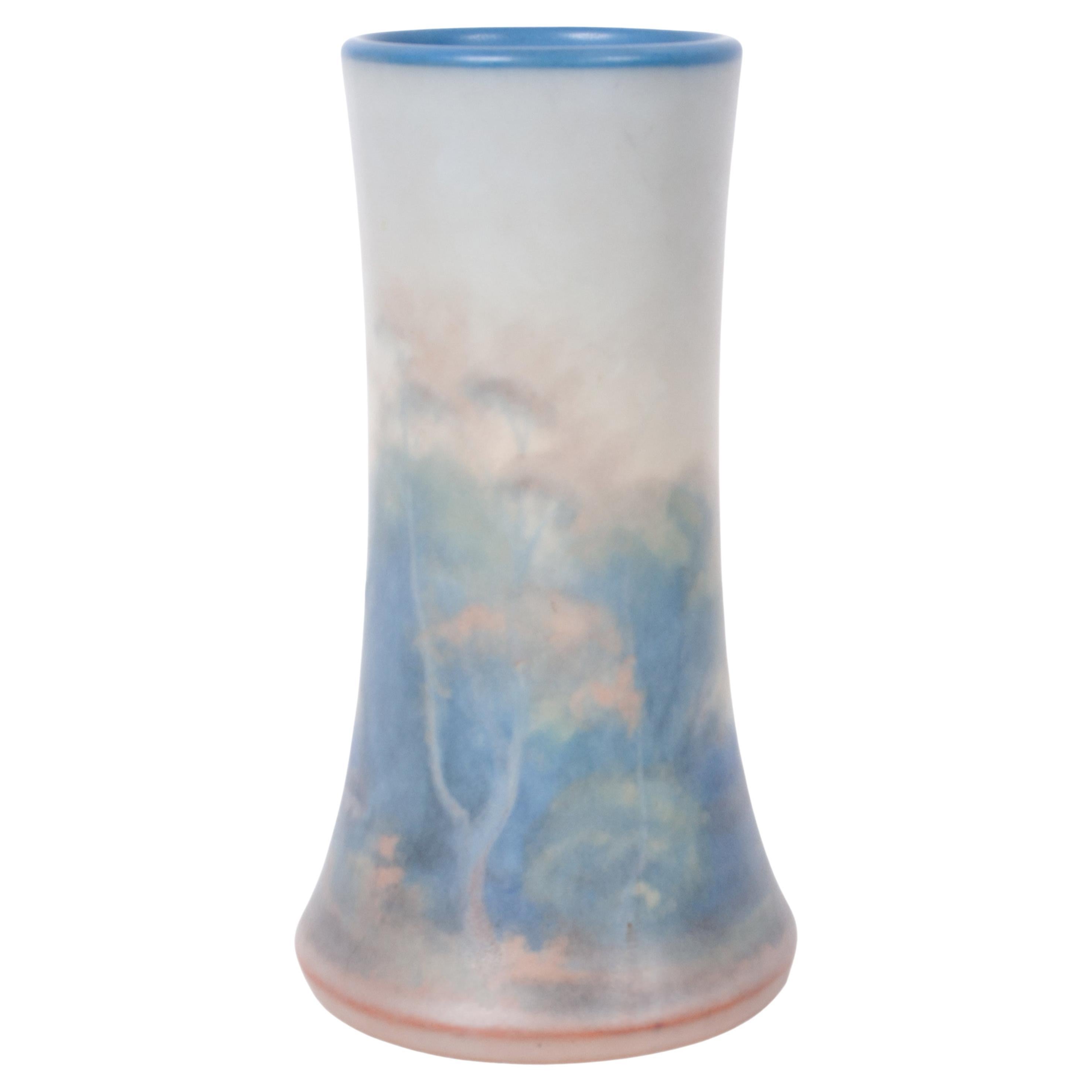 A fine antique Arts & Crafts pottery scenic landscape vellum glaze pottery vase by Fred Rothenbusch for Rookwood pottery, dated & signed 1925.
This very beautiful Rookwood scenic landscape vase presents a hazy landscape which is typical of
