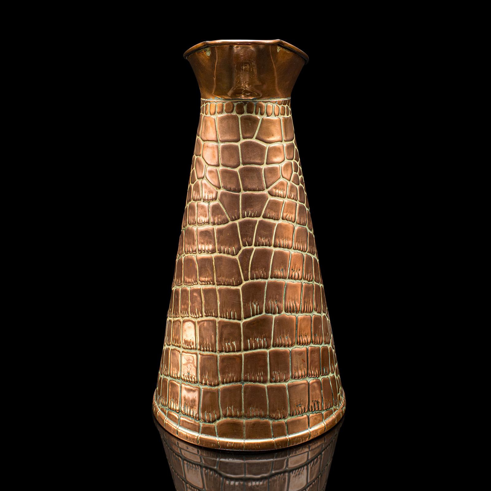 
This is an antique pouring jug. An English, copper serving tankard in Arts & Crafts taste, dating to the late Victorian period, circa 1900.

Superb decorative pattern adds distinction to this fine copper jug
Displays a desirable aged patina and in