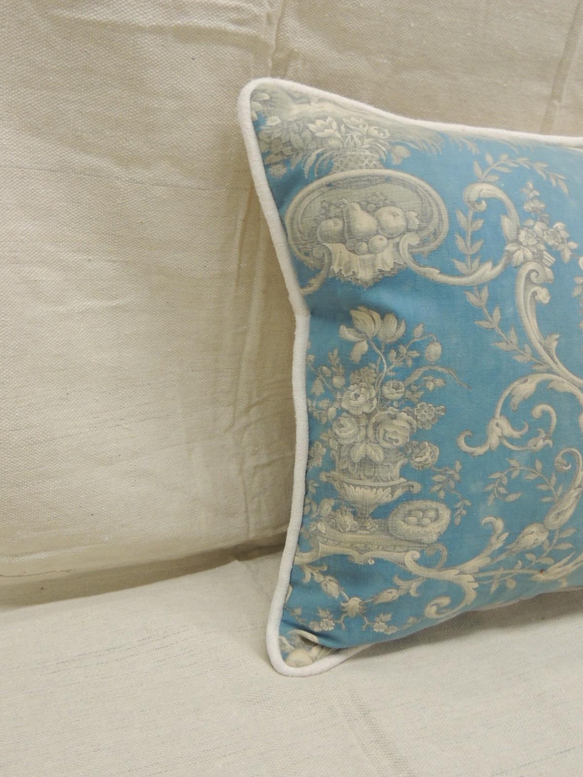 Antique powder blue and natural printed toile bolster decorative pillow, natural linen self-welt all around.
The blue center of the antique textile depicts a group of angelic cherubs at play in the garden. handcrafted and designed in the