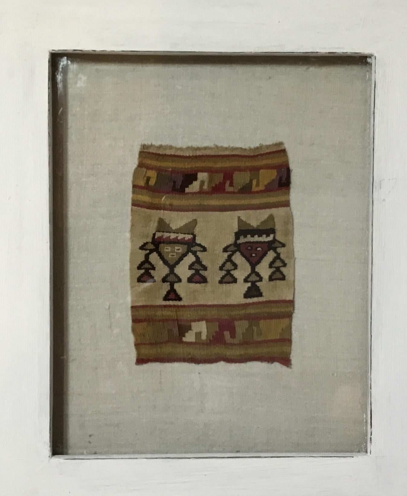Museum quality handwoven slit tapestry pre Colombian textile fragments from Peru, featuring geometric motif of two human faces .the textile is professionally mounted on acid free Matt in a very decorative hand-painted shadow box.
Textile dated from