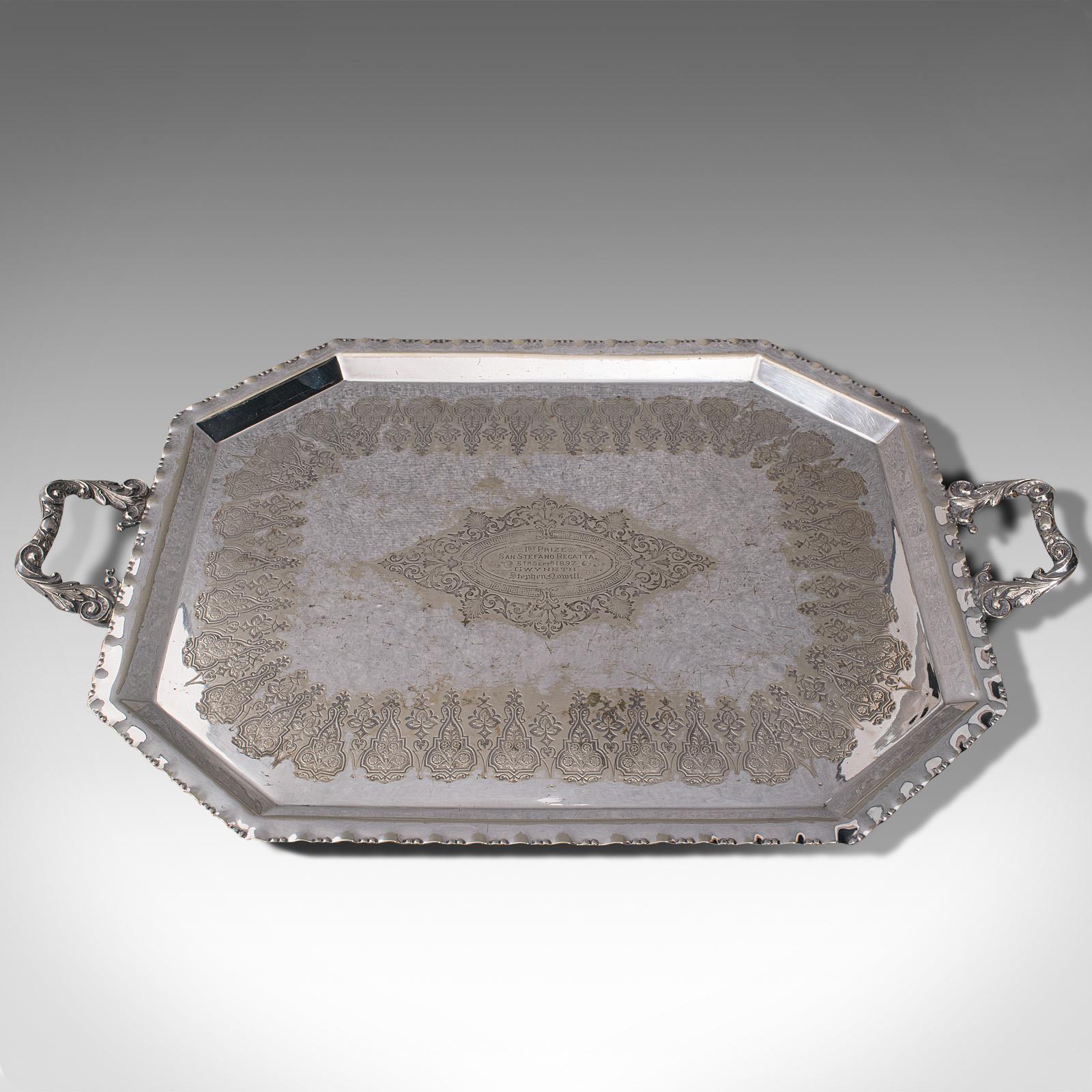This is an antique presentation serving tray. An English, silver plated afternoon tea platter, dating to the late Victorian period, circa 1895.

Prize-winning celebration tray with fascinating detail
Displays a desirable aged patina, with light