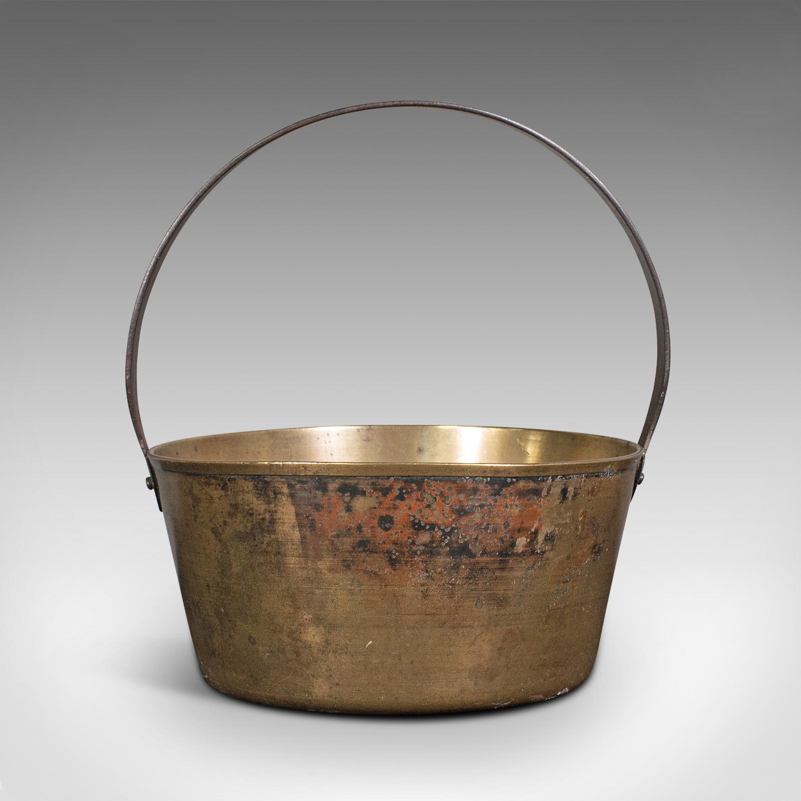 This is an antique preserving pan. An English, bronze jam cooking pot, dating to the late Georgian period, circa 1800.

Pleasingly weathered Georgian pan
Displaying a desirable aged patina throughout
Bronze presents weathering commensurate with
