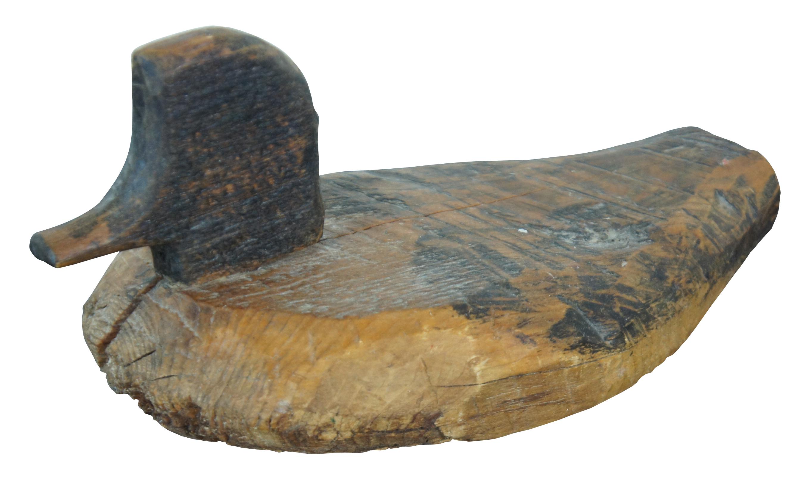 Antique duck decoy, carved of pine featuring primitive form.
