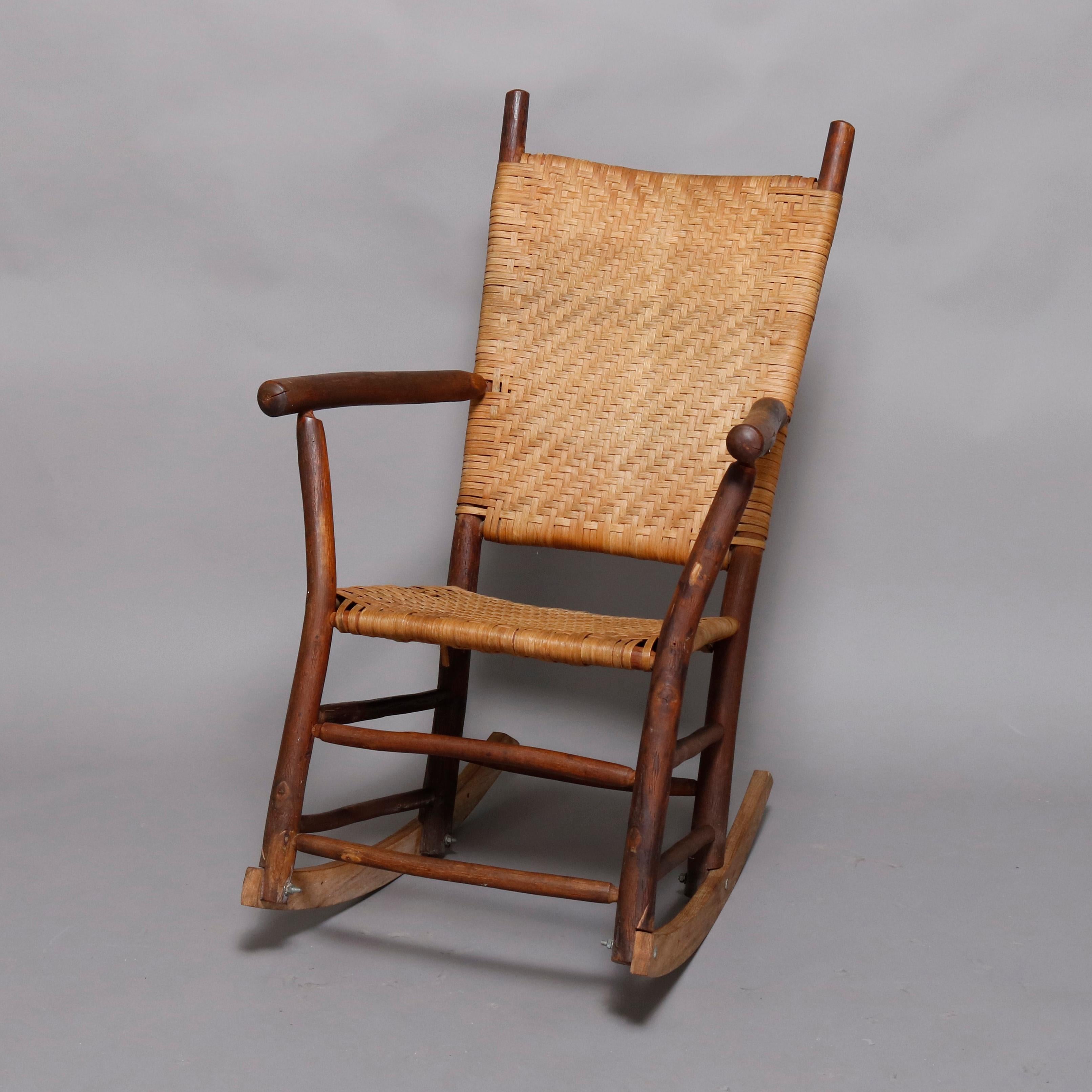 An antique and Primitive style Old Hickory School 3-piece porch set offers stick form armchair, rocker and settee having caned seats and backs, circa 1910

***DELIVERY NOTICE – Due to COVID-19 we are employing NO-CONTACT PRACTICES in the transfer of