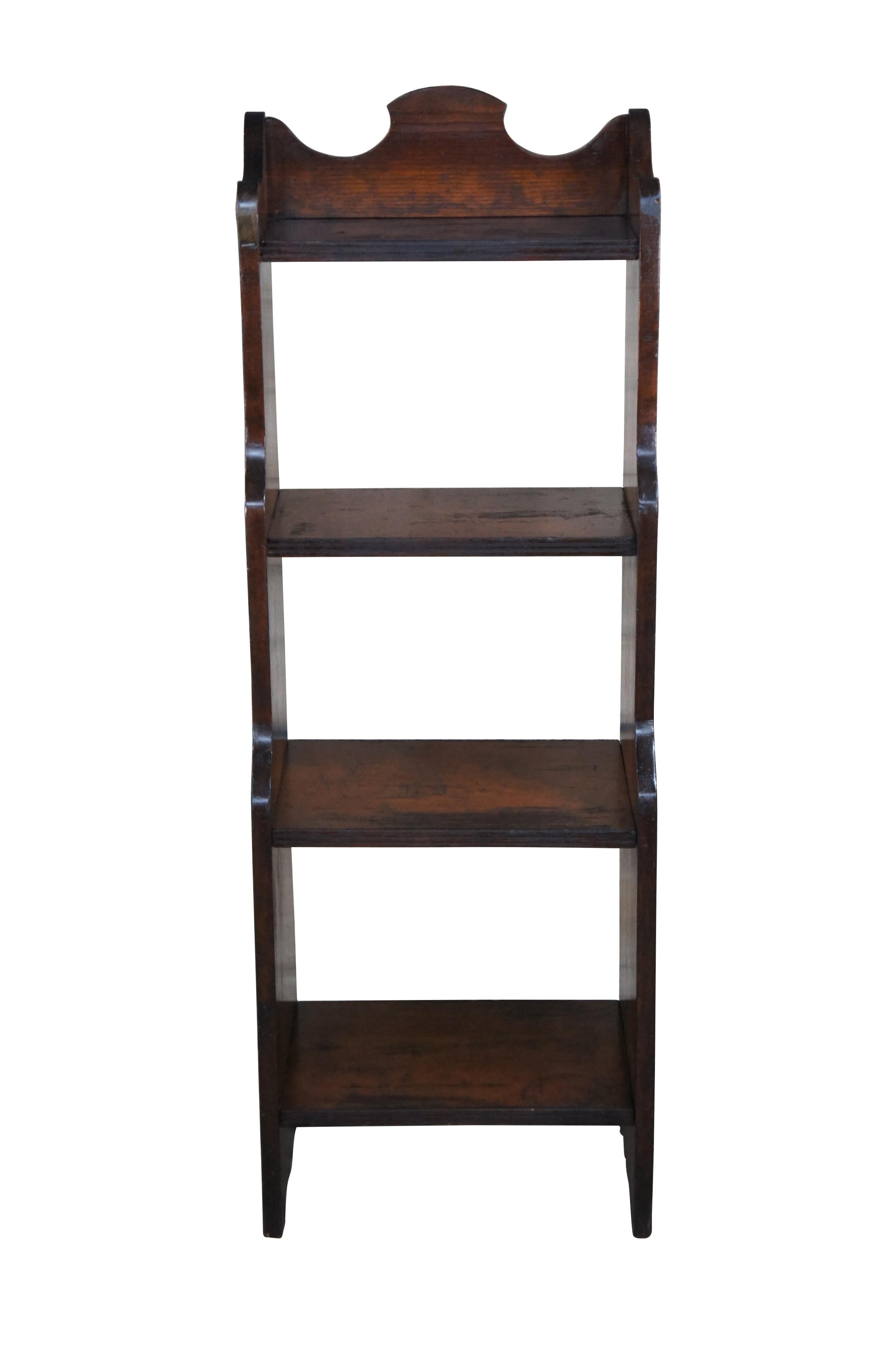A quaint tiered waterfall bookcase.  Features four shelves and a countoured backsplash.  

Dimensions:
17